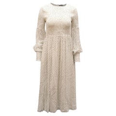 Vestido midi con lunares y fruncido de Ganni, en viscosa blanca