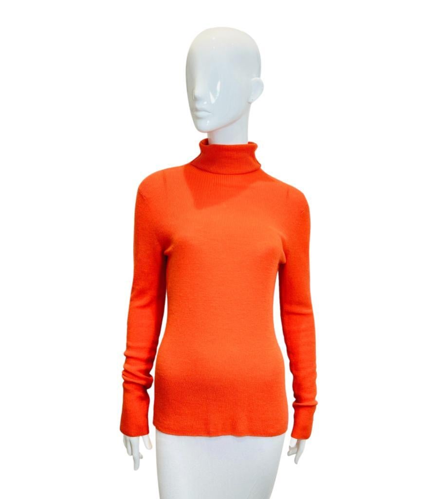 Ganni Rollneck Cut-Out Wool Jumper

Bright orange, long sleeved jumper designed with cut-out detail to rear.

Featuring fitted silhouette and roll neckline.

Size – L

Condition – Very Good (Brand New - With tags, two minor pulls)

Composition –