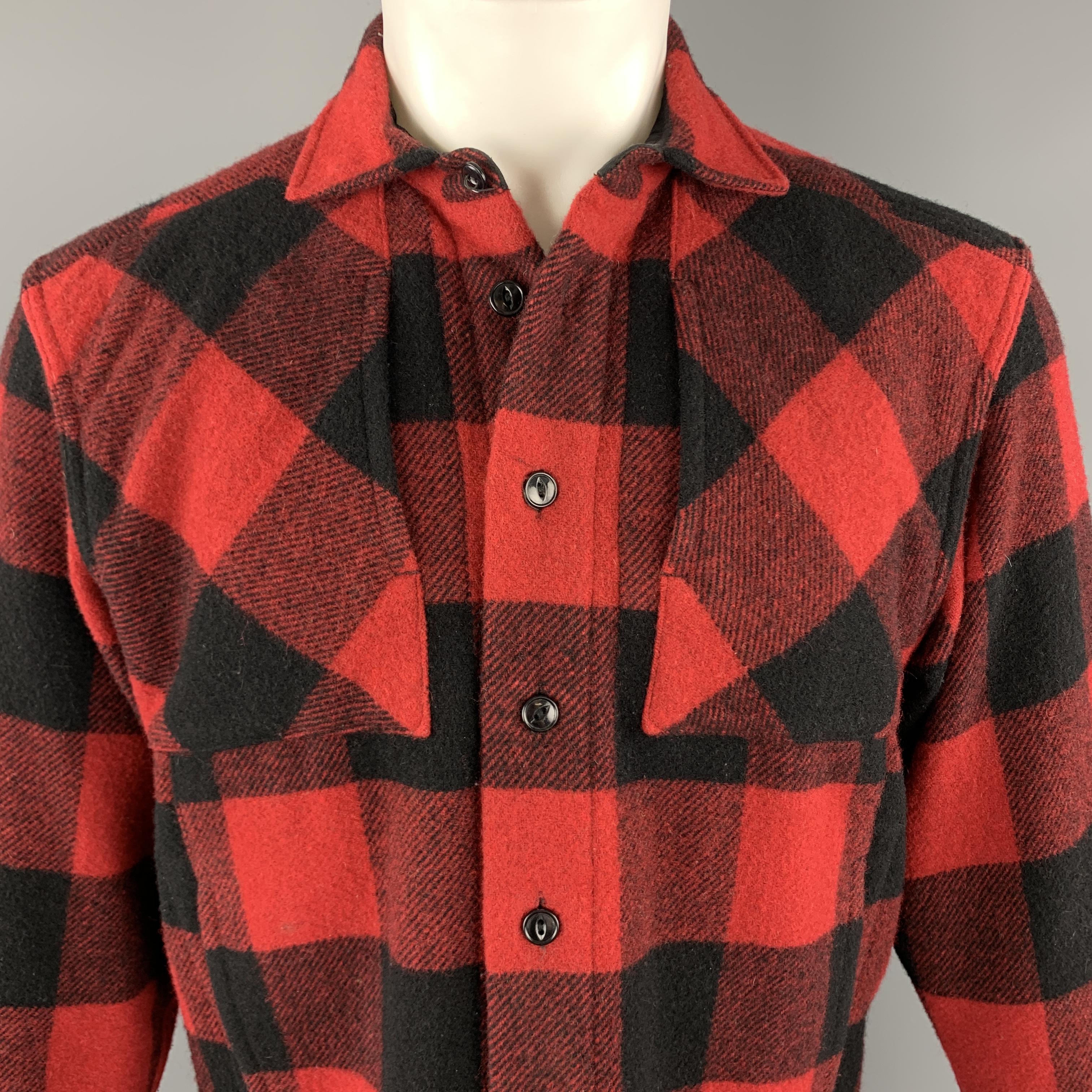 GANRYU Comme des Garcons flannel shirt comes in red and black wool blend with patch slit pockets. Minor Wear. Made in Japan.

Very Good Pre-Owned Condition.
Marked: S

Measurements:

Shoulder: 18 in.
Chest: 44 in.
Sleeve: 23 in.
Length: 26 in.
