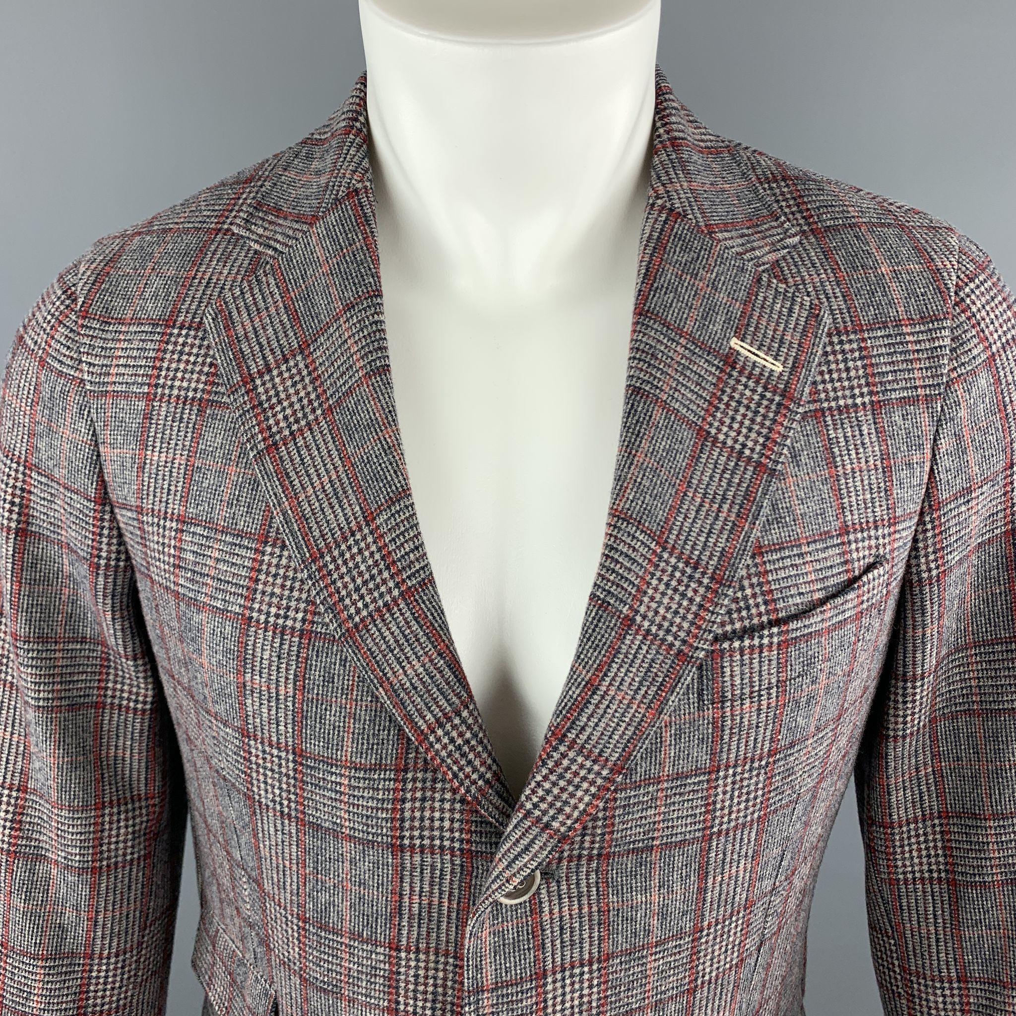 GANT RUGGER Sport Coat comes in a gray and red plaid wool material, with a notch lapel, slit and flap pockets, single breasted, functional buttons at cuffs, a double vent at back, unlined. Made in Portugal. 

Excellent Pre-Owned Condition.
Marked: