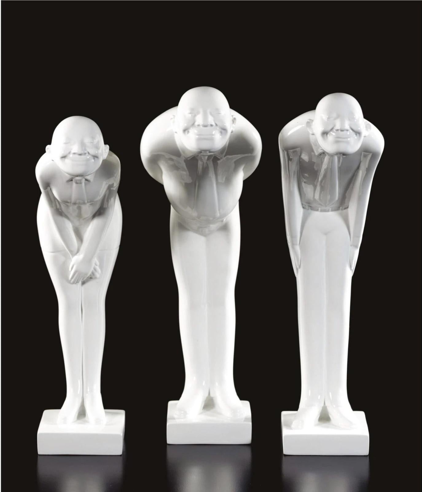 Standard Times 

By Gao Xiao Wu

Gao Xiaowu is a contemporary Chinese sculptor known for his whimsical bronze figures that blend humor with social critique. His work explores themes of urban life, conformity, and cultural identity in modern