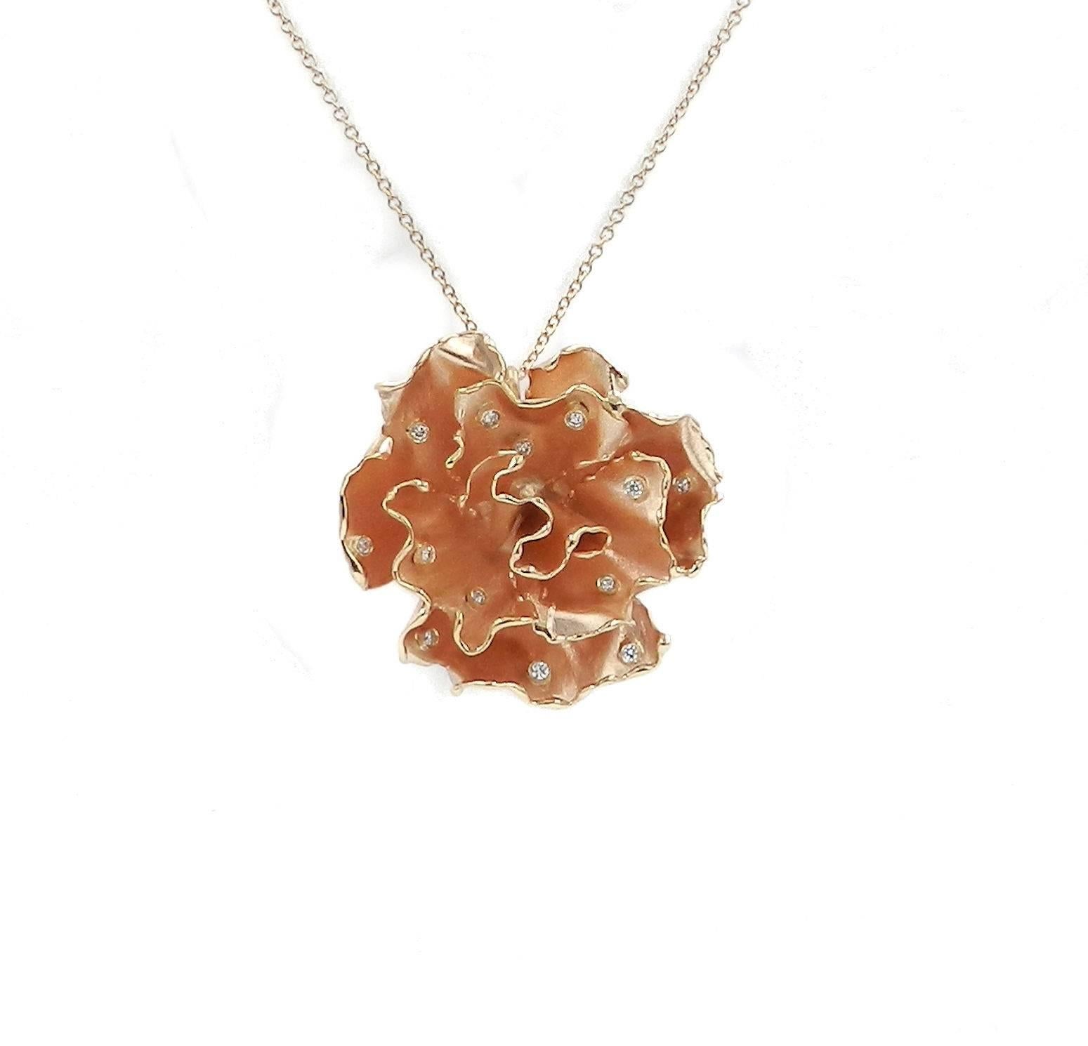 A one of a kind piece, hand made, 18kt Rose gold pendant in a rose flower shape. This flower is hand made, set with white diamonds weight carat 0.45. The flower size is mm40. 
The chain is in 18kt rose gold and its lenght is cm 48