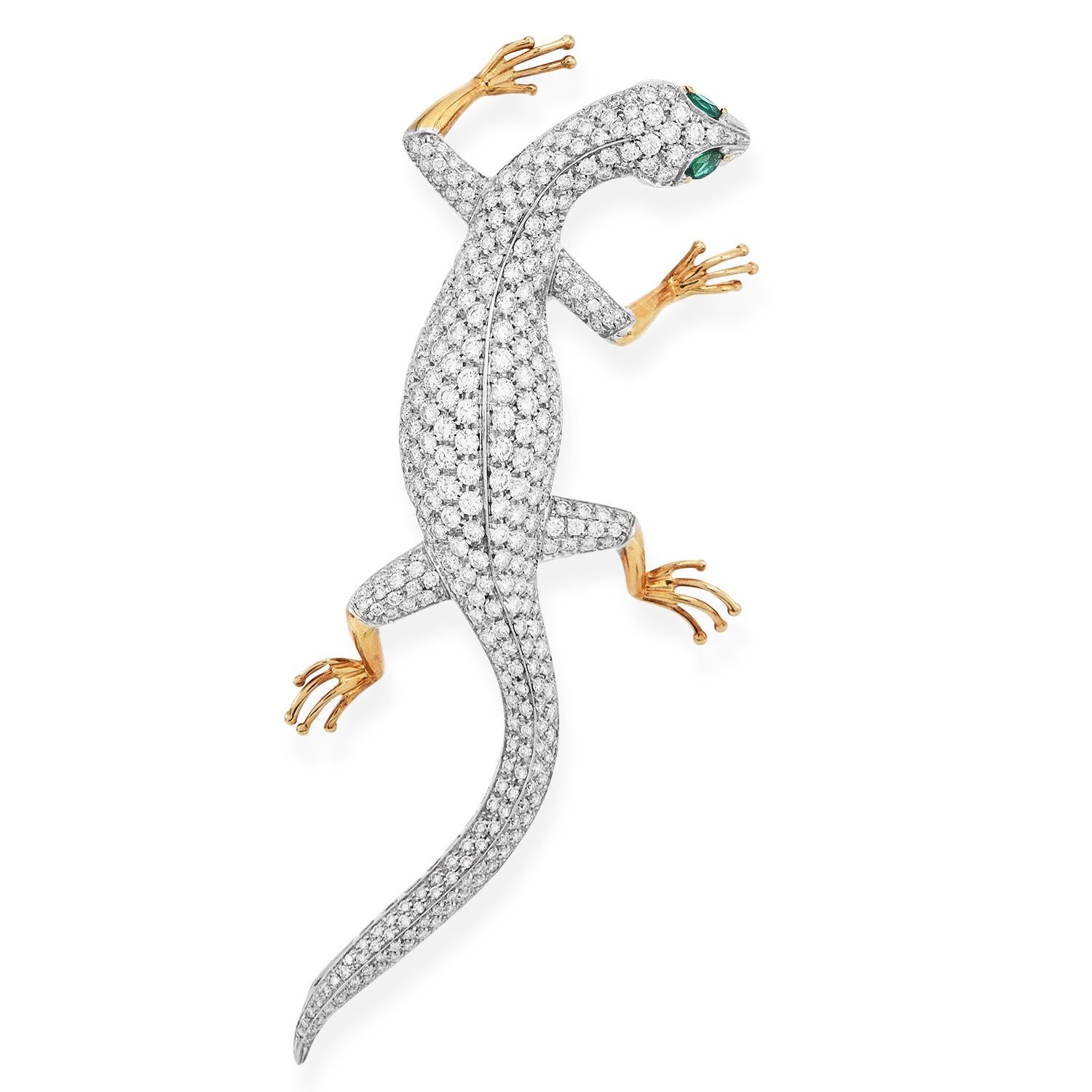 Presenting from the house of Garavelli a Lizard Motif Brooch Pin adorned with Natural Round Diamonds and Natural Emerald Gemstone eye.

Crafted In 18K Yellow and white and yellow gold.

Marked: 