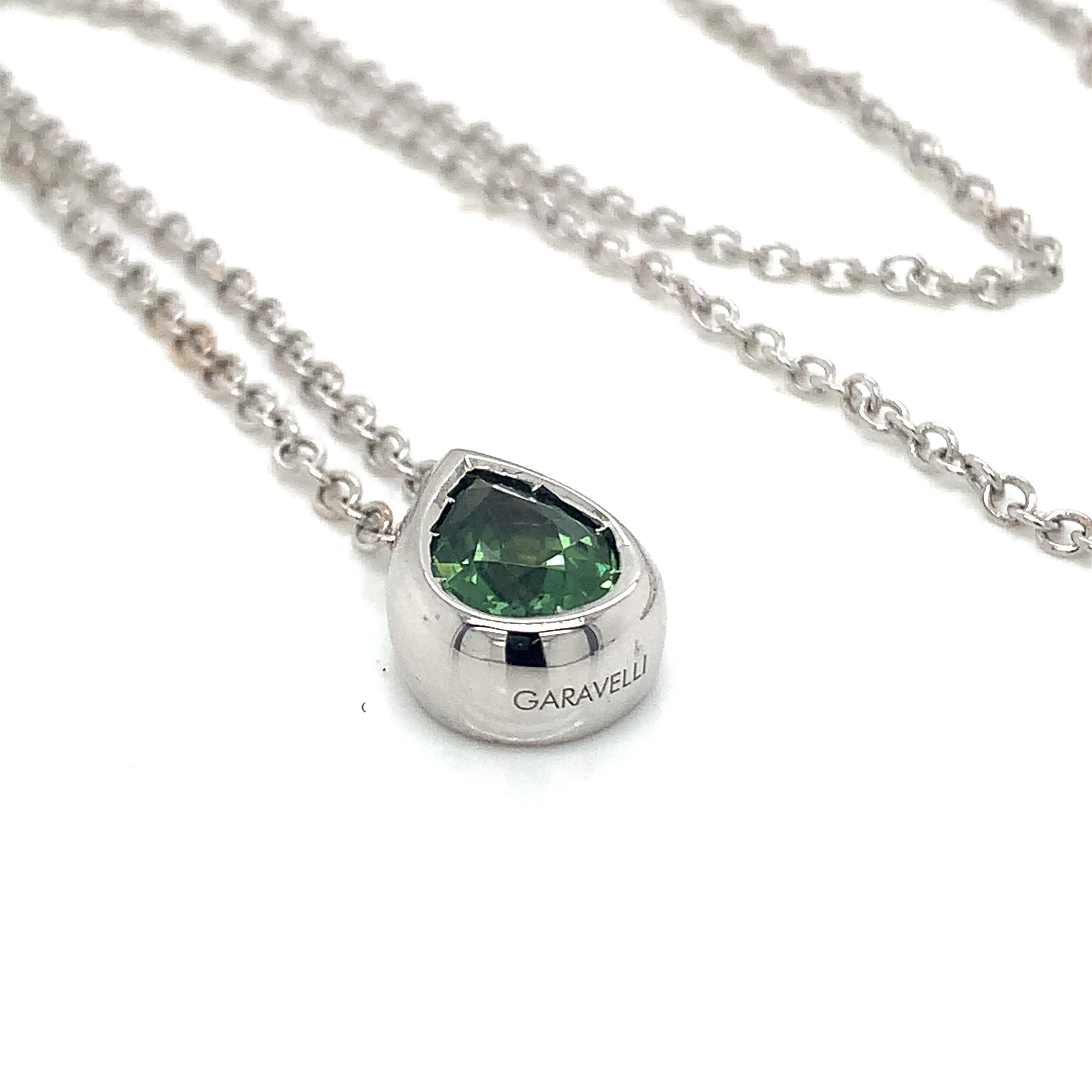 Garavelli DROP Pendant in 18kt White Gold with Green Tourmaline from the new Giotto Collection DROP pendant .
18kt gold Necklace included , lenght 19 inches with a loop at 17
18kt gold grs 6.90
Green Tourmaline mm  9 x mm 6  carats 1.20
Tourmaline