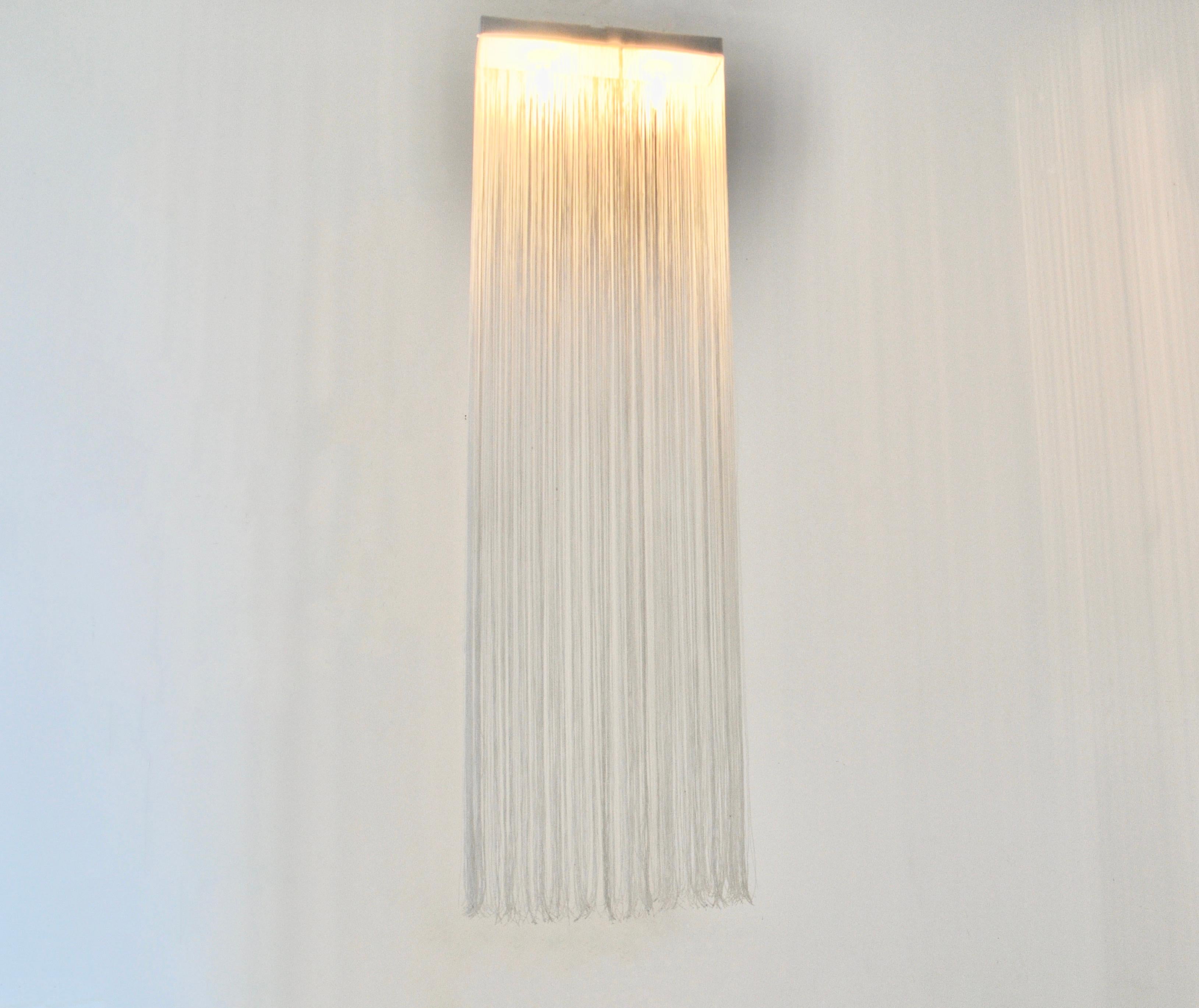 Ceiling light with fabric fringes designed by Mariyo Yagi. Stamped Sirrah, Mariyo Yagi. Wear due to time and age. 