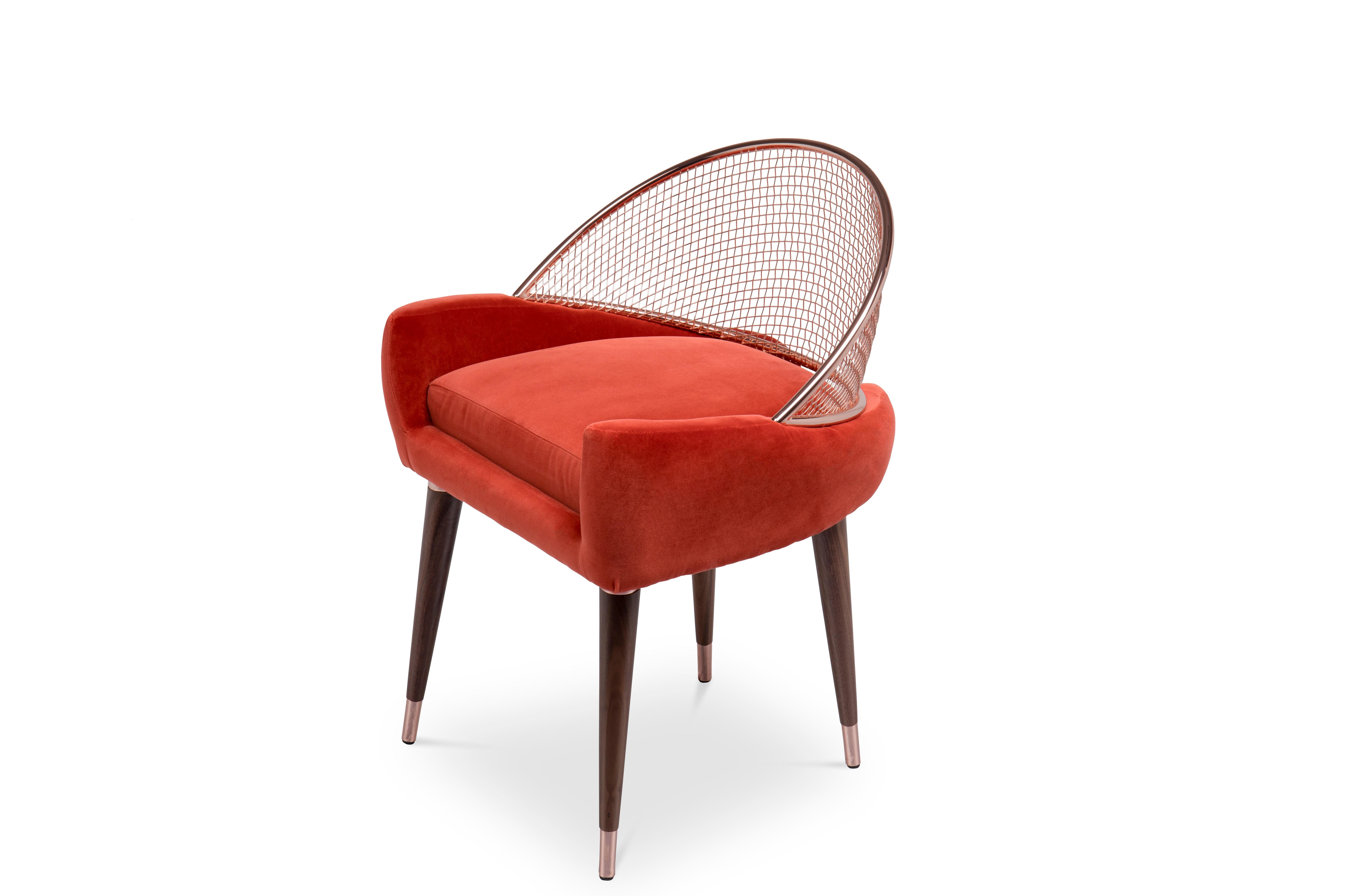 Mid-Century Modern Garbo Dining Chair in Red Velvet by Essential Home

Mid-Century Modern Garbo Dining Chair in Red Velvet features a velvet upholstered seat with a removable cushion, completed by a crescent low back that is handmade in brass,
