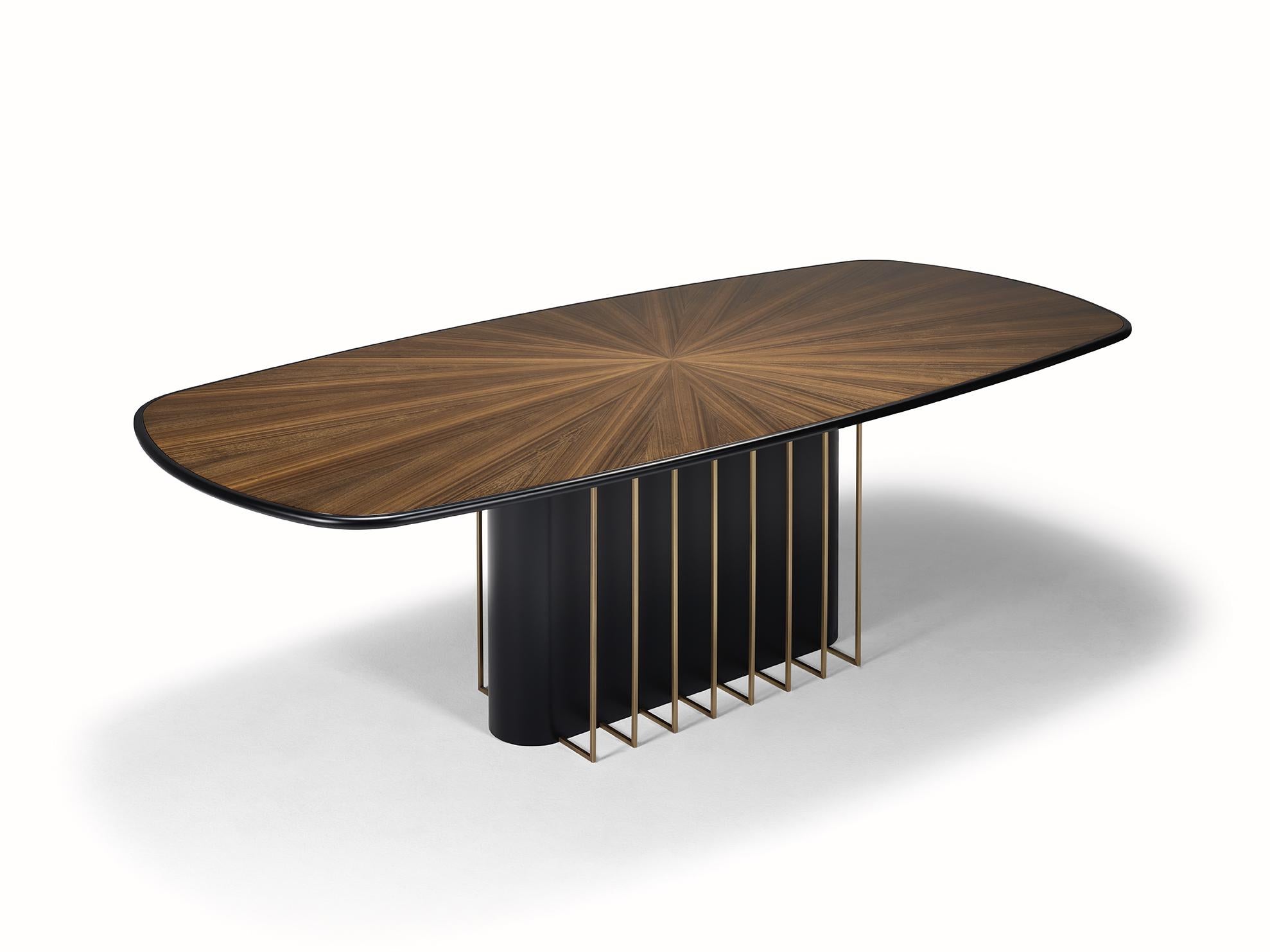 The distinguished GARBO dining table is graced by the subtlety of its shapes, with simple lines but full of character. Garbo is made of wood, enriched with a brass frame on the base for a refined and sophisticated look. Made of a wooden structure,
