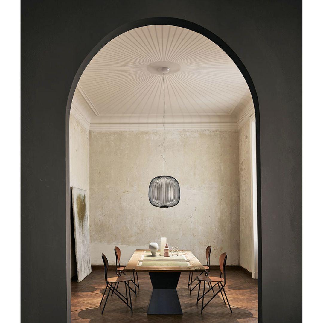 Garcia & Cumini large 'Spokes 2’ metal suspension lamp in black for Foscarini

Designed by Cumini + Garcia and produced by Foscarini, the Italian lighting firm founded in Venice on the legendary island of Murano, where generations of master