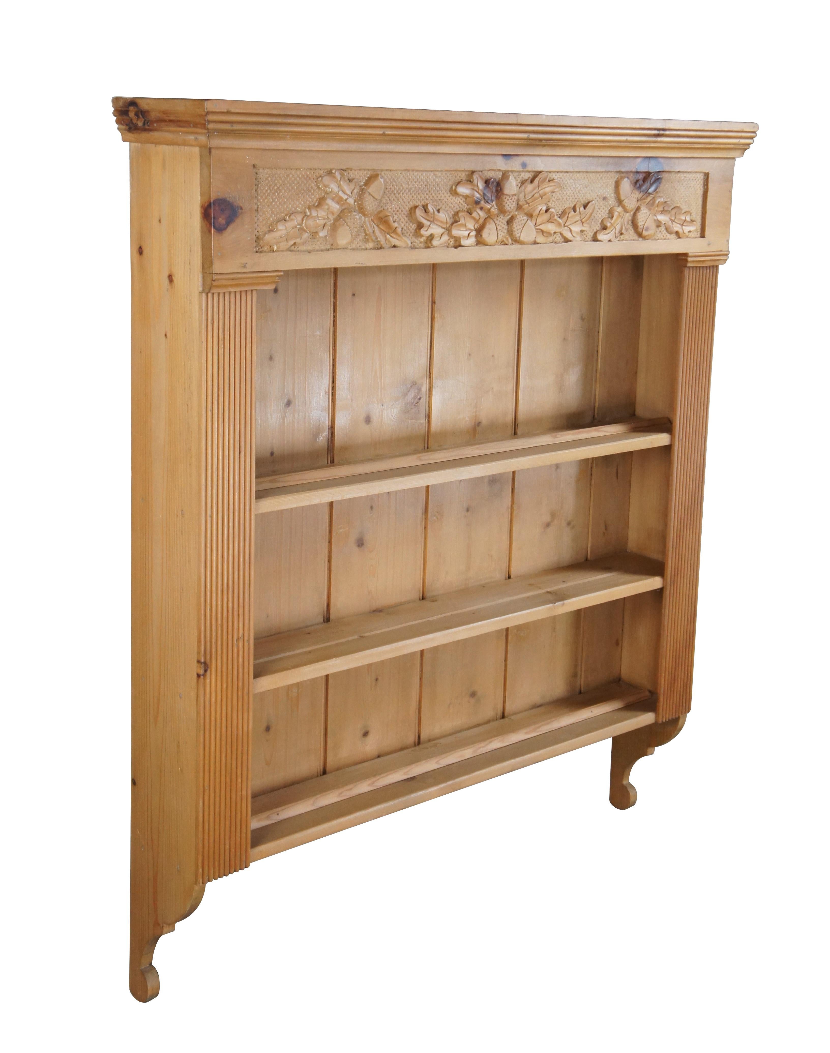Very large vintage Garcia Imports country farmhouse wall shelf / book shelf / plate display rack.  Made of pine featuring English styling with acorn and leaf theme carving and three tiered shelves flanked by fluted moulding.

Dimensions:
41