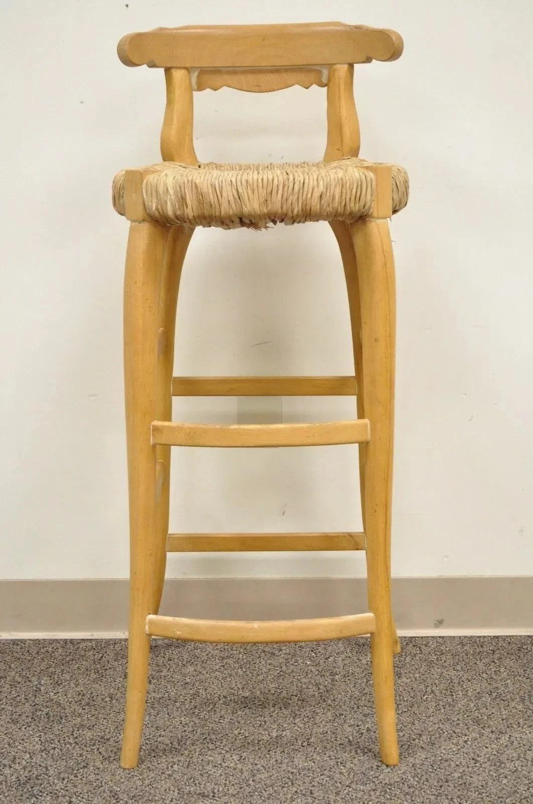 Garcia Imports Spain French Country Primitive Wooden Rush Seat Bar Stool Chair. Item features solid wood construction, Woven Rush Seat, Shapely legs, Stretcher Base, Lightly Distressed Finish, Great Modernist Form. Circa Late 20th Century, Spain.