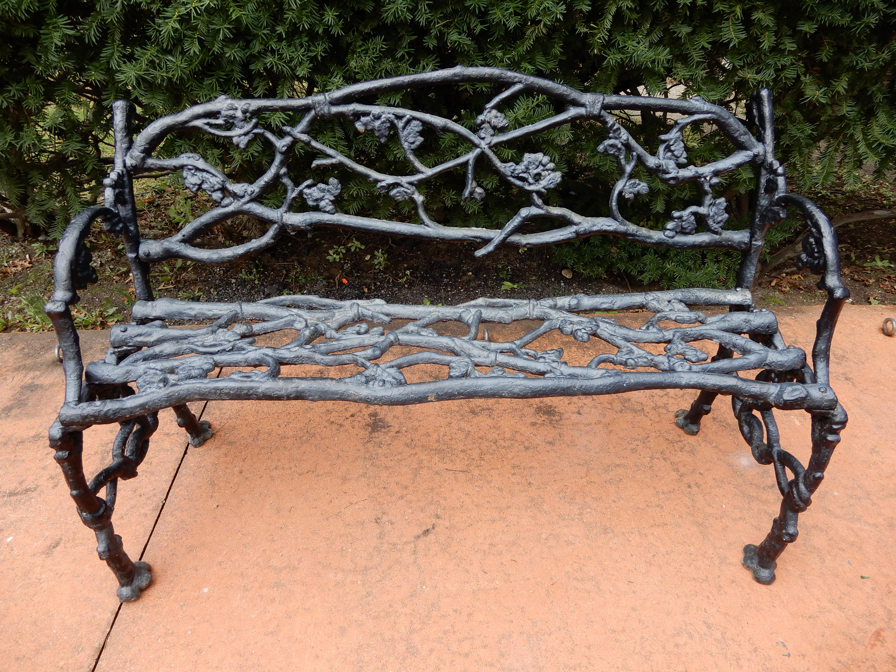 A 19th century cast iron Rustic or twig bench with a matching cast iron rustic or twig chair. The rustic chairs are not easily found. The cast iron garden bench in the naturalistic twig or rustic pattern. The chair and bench are adorned with details