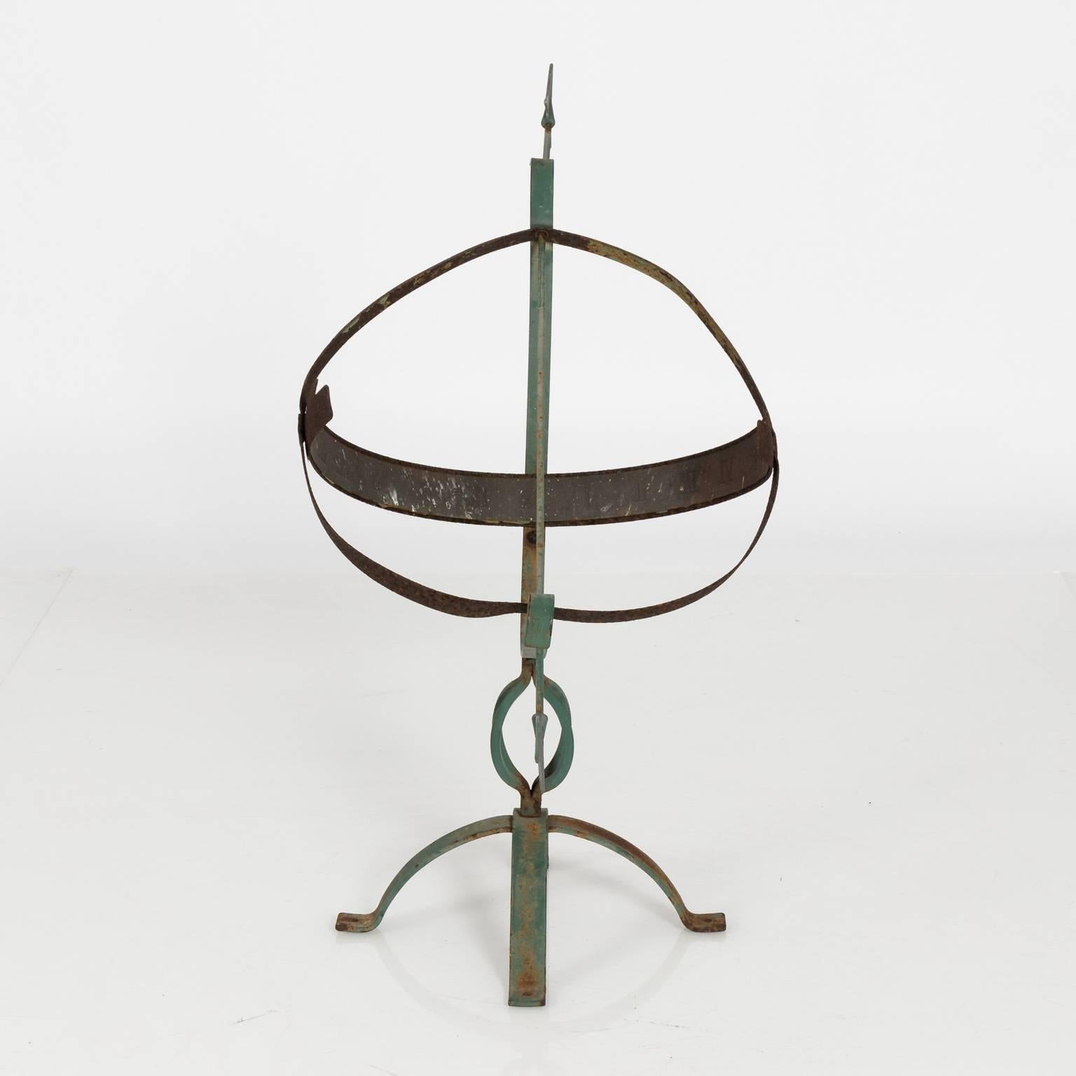 Metal garden armillary sphere in a green weathered finish, circa 20th century.
 