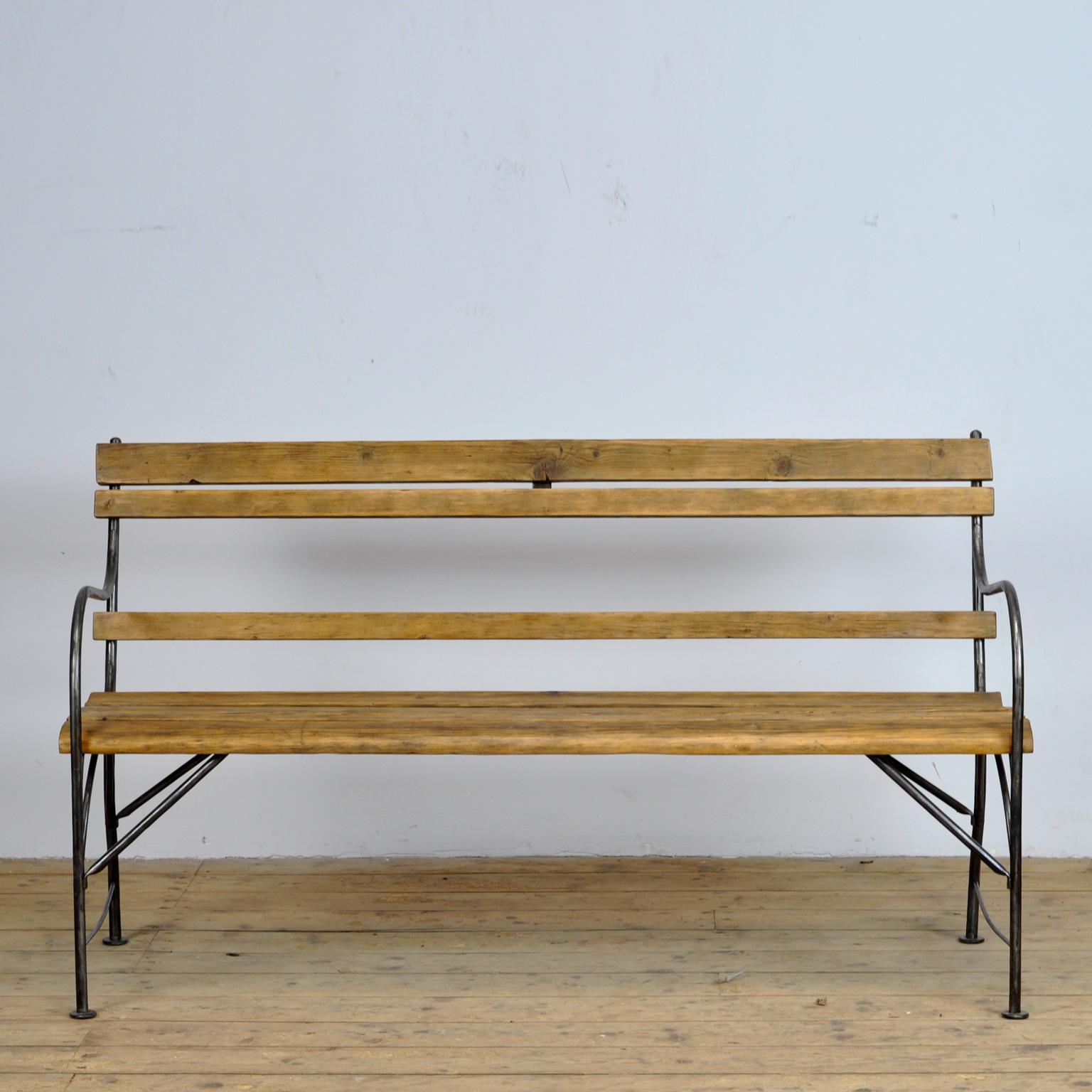 Iron and wooden garden bench from the 1940's. The metal is polished.
Seatheight is 47 cm.