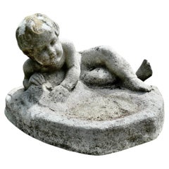 Garden Bird Bath with a Small Child Feeding the Birds