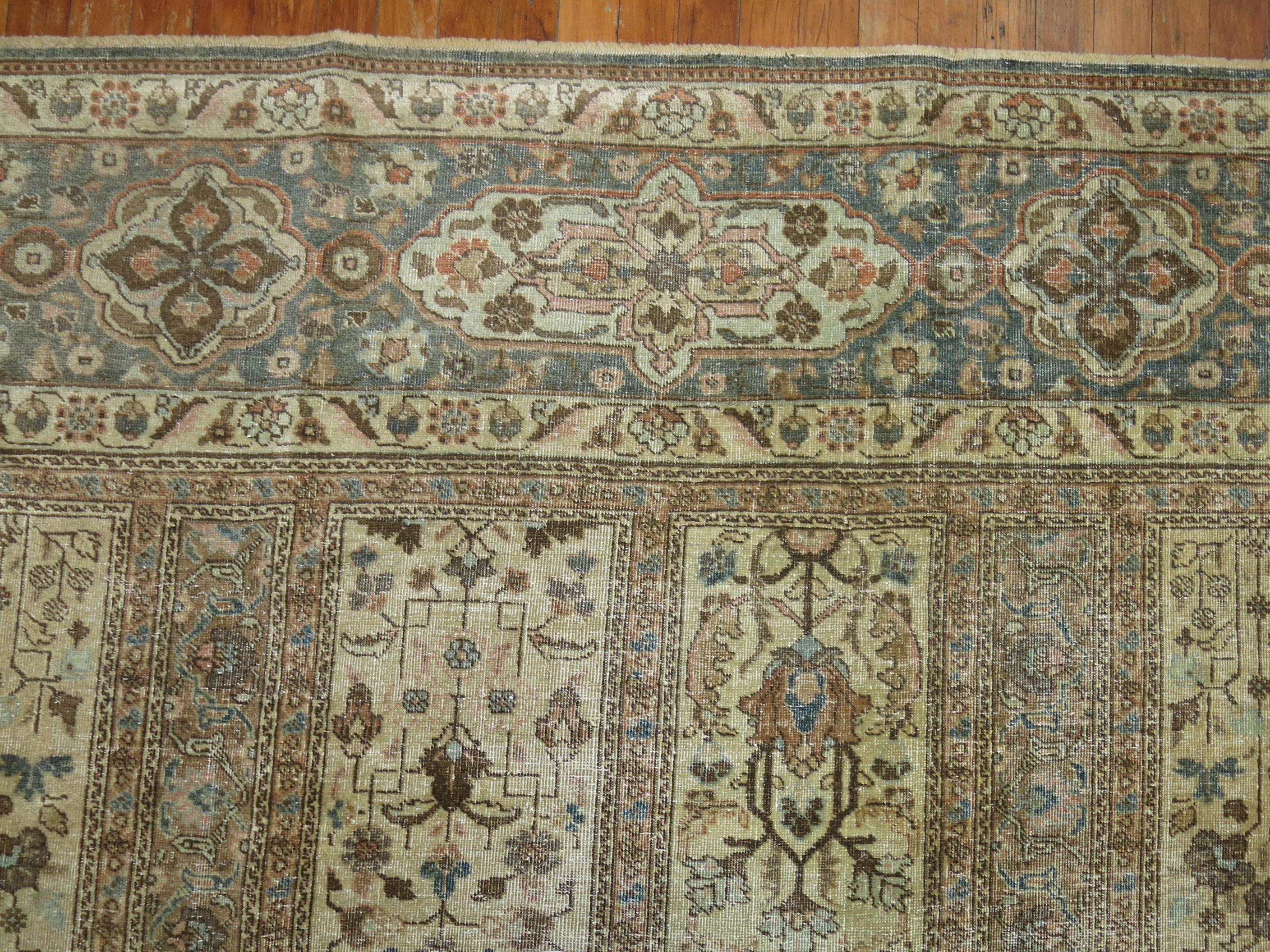 A room size antique Persian Tabriz Oriental rug woven early 20th century with a garden box all over design in earth tones

Measures: 10' 12'11''.
  
 