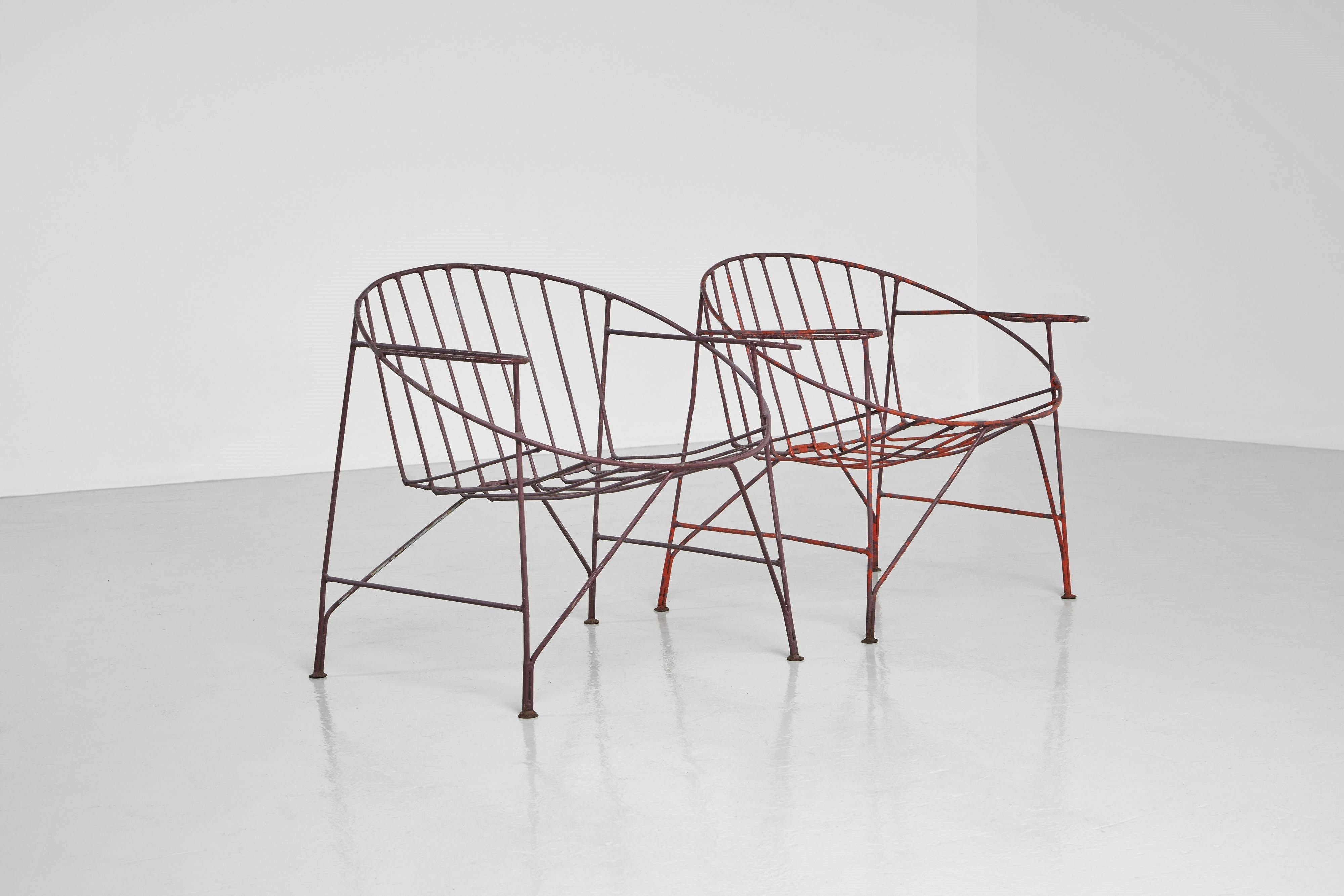 Beautiful iron garden chairs in the style of Mathieu Mategot and Jean Royère made in France 1950. While the manufacturer remains unknown, these chairs beautifully capture the essence of their renowned designs. With their round shape and bend metal