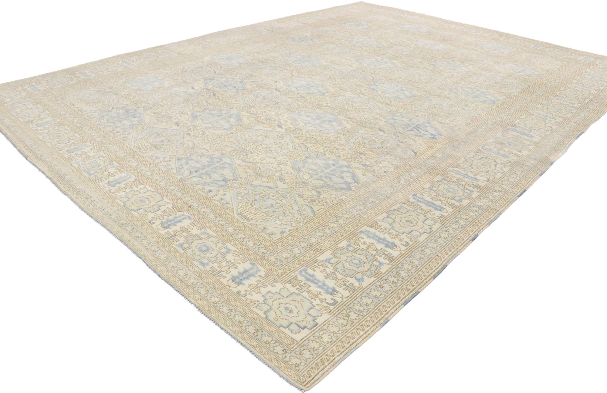 53259, garden design vintage Turkish Oushak rug with modern coastal style. Balancing traditional sensibility and Coastal style, this hand knotted wool vintage Turkish Oushak rug is poised to impress. The abrashed antique washed field features an