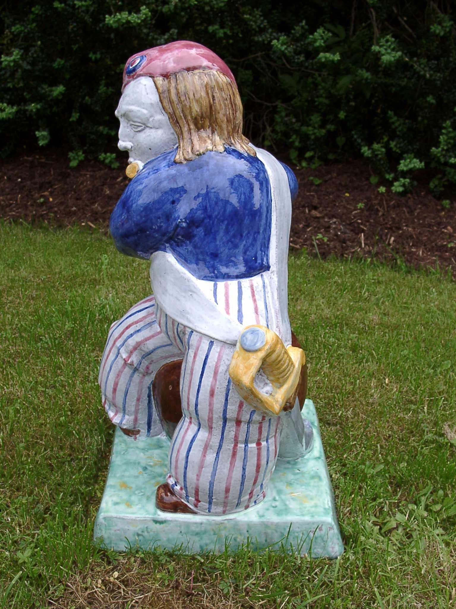 This figure was designed by Josef Wackerle in 1913 for Porzellan Manufaktur Nymphenburg and is still in production today. It is hand crafted and hand painted of Nymphenburg majolica and Nymphenburg made colorants. The piece is fired to the