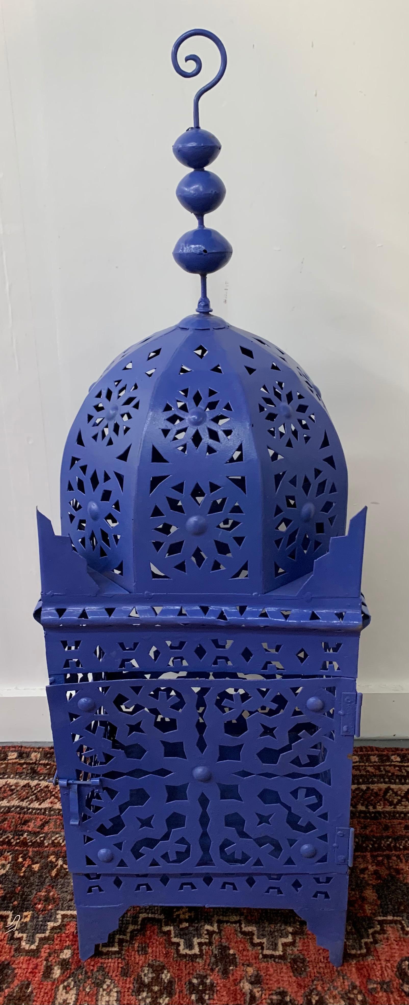 Garden floor lantern or candleholder in blue, a pair

The pair of floor lanterns are hand carved of metal painted in blue Majorelle inspired by Yves Saint Laurent Majorelle garden. Each lantern features a beautiful intricate design to emit soft