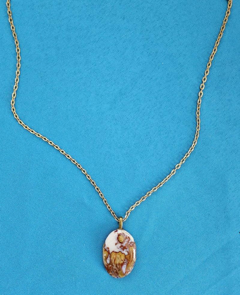 Garden/Floral Motif Naturally Occurring in Semiprecious Stone Pendant Necklace
This is a highly unusual and lovely piece!  
Note the colors might look a little different on each monitor.  On our monitor the photos colors look a little bit more