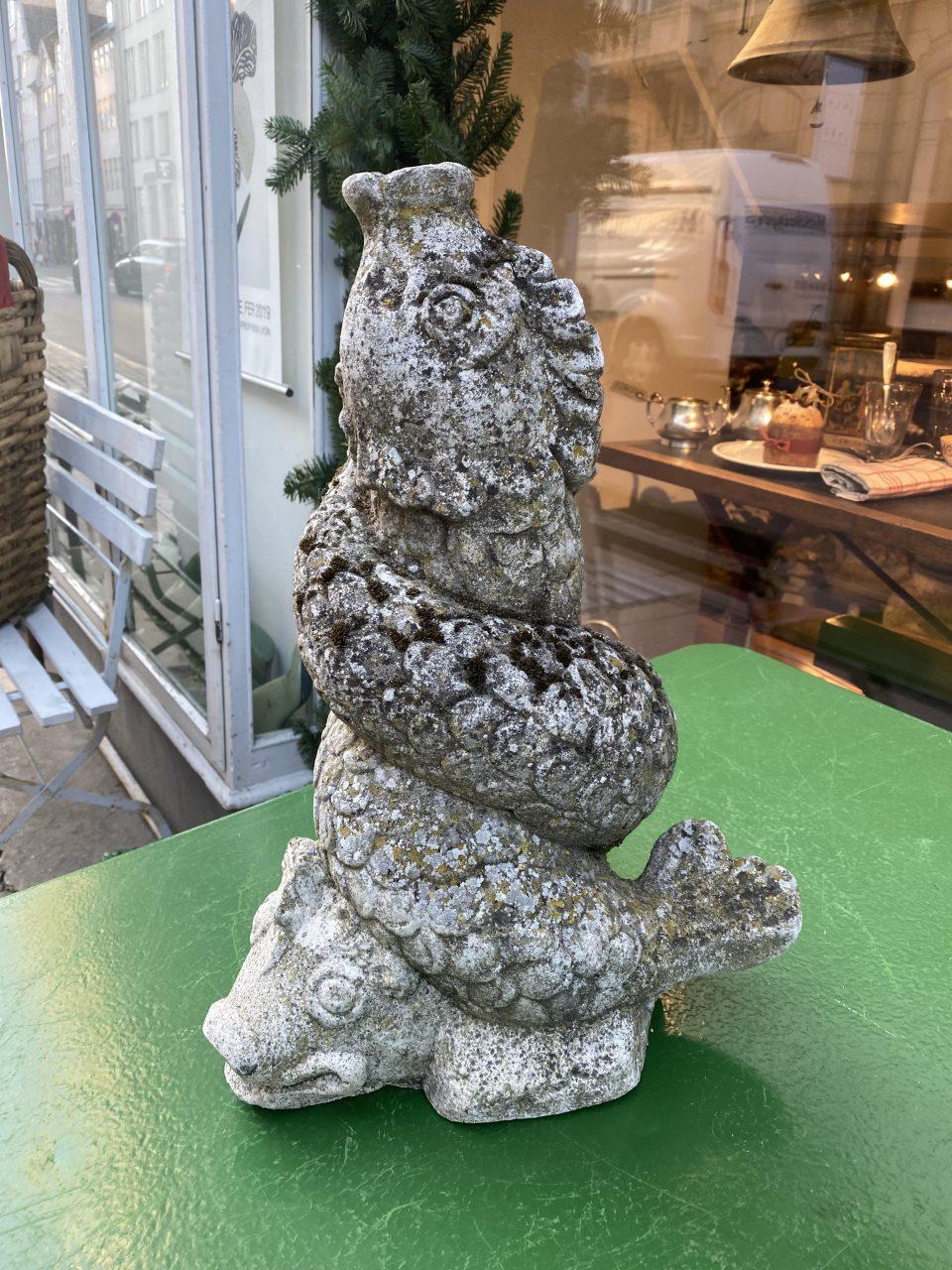 Romantic old French weathered cement figure from the South of France. The figure depicts two fish-like fabled creatures tightly entwined.

The figure has previously stood in the middle of a mirror pond / basin in a distinguished French garden, and