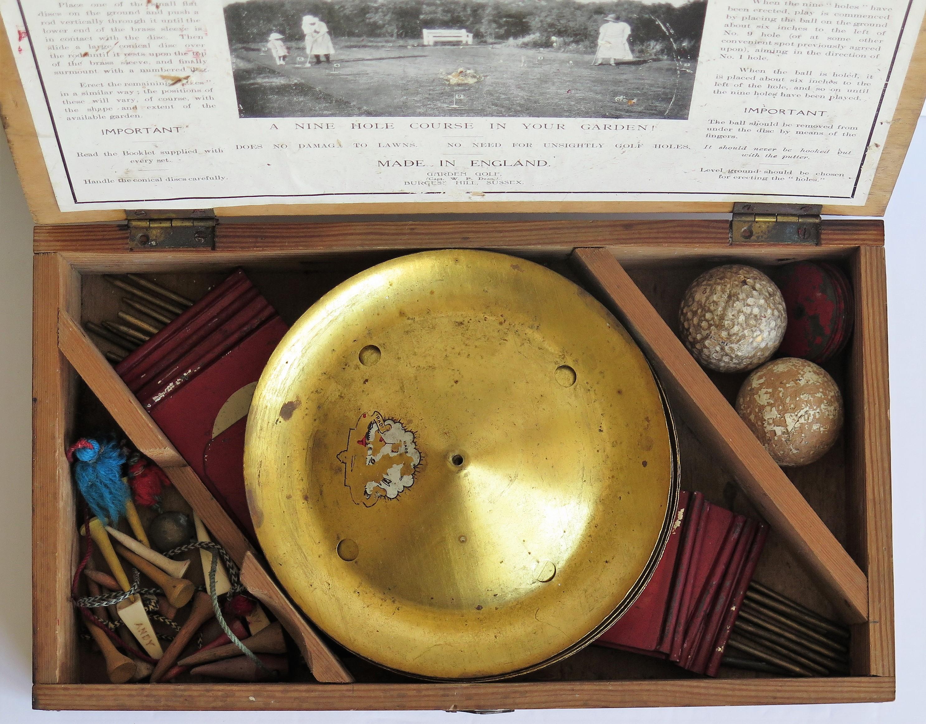 This is an original Garden Golf Game, coming with its own wooden storage box, all dating to the early 20th century, circa 1920.

This is a Classic game of strategy and skill, fun to play for all age groups and useful for any player to practice on