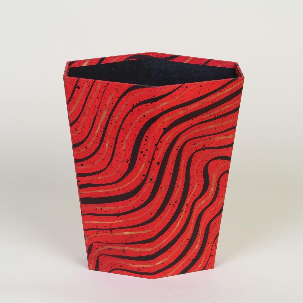 Acrylic and shellac based inks on Ingres paper; book binding board
Signed and dated by artist on underside

A hexagonal hand-constructed waste paper bin which tapers as it reaches the floor. The basket is wrapped in a red-based hand-painted paper