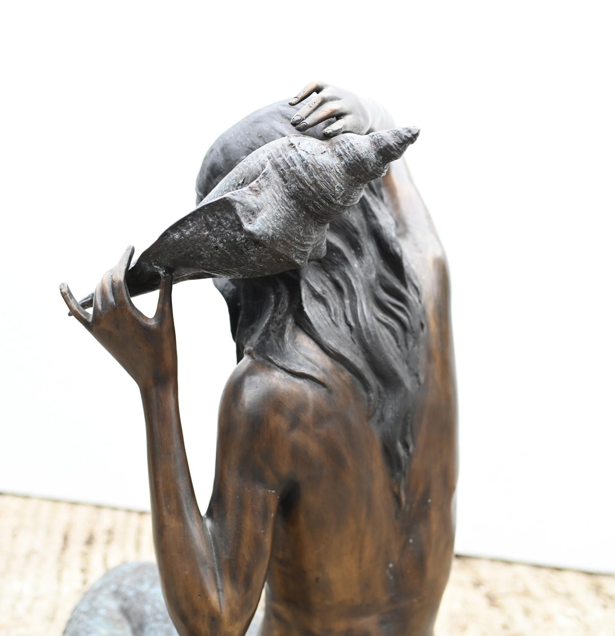 Fantastic bronze mermaid fountain
Cast from bronze with lovely patina
Of course being bronze this can live outside with no fear of rusting
Piece is a fountain - the inlet tube is under her fin and the water pours from the conch shell
Great for a