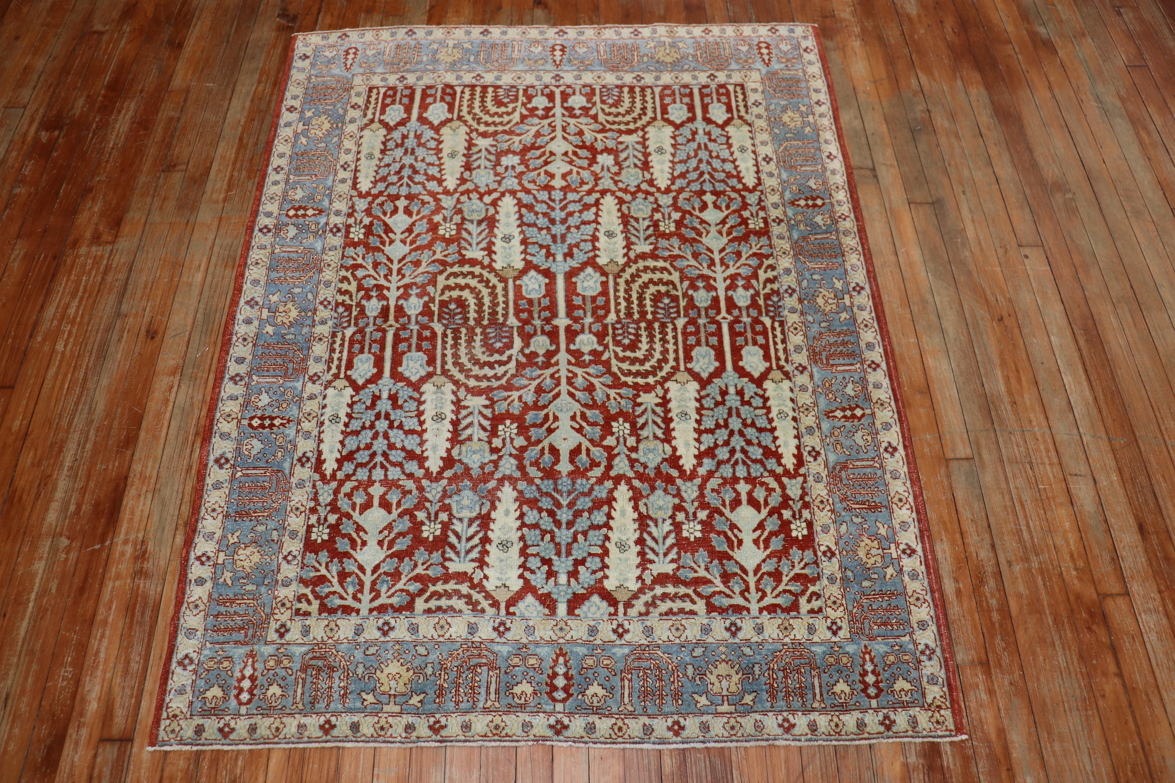 Garden of Paradise Motif mid-20th century Persian Tabriz rug with a deep red field, accents in ivory and icy blue

Measures: 4'6
