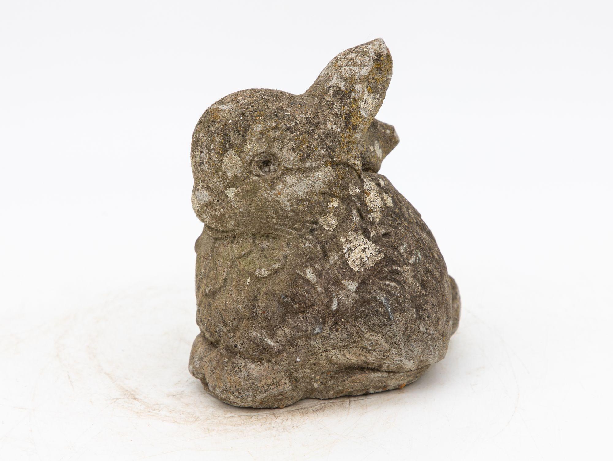 This delightful mid-20th century French garden ornament brings the playful charm of a rabbit or bunny to your outdoor space. This whimsical creature features a gray lifelike body, accentuated by charming touches of patina throughout. The adorable