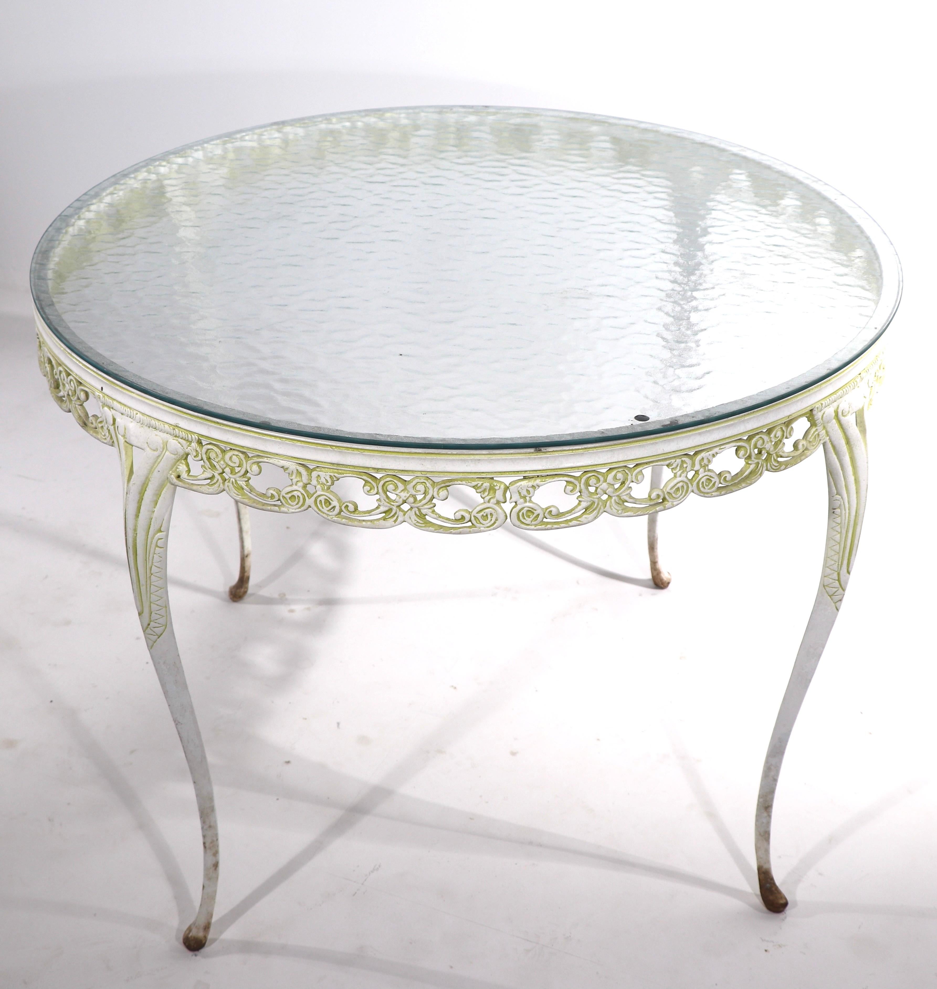 glass top dining table with wrought iron base