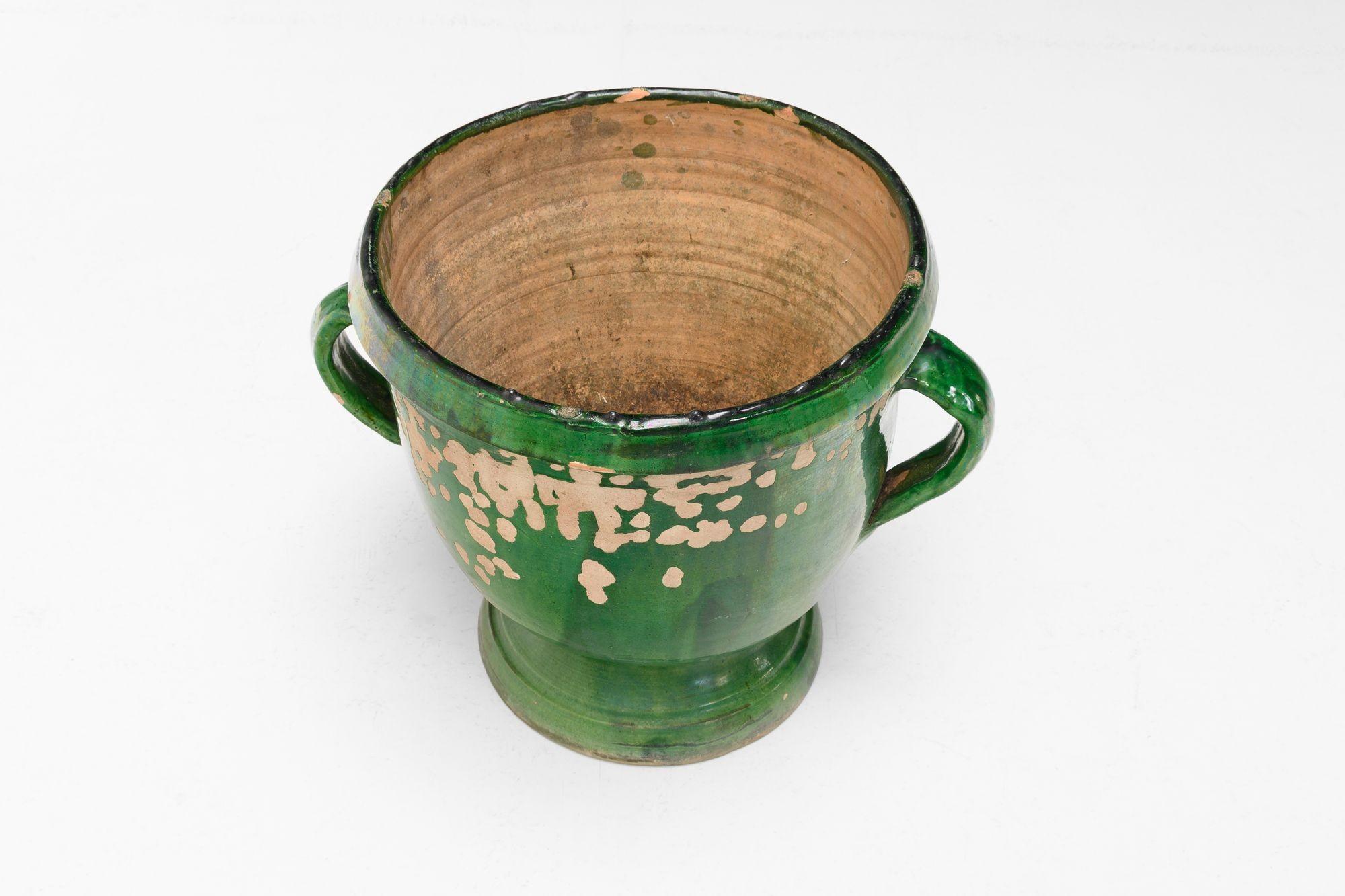 Two handled terracotta French garden pot in original green glaze finish. Circa 1890

H 39cm x W 46cm x D 39cm