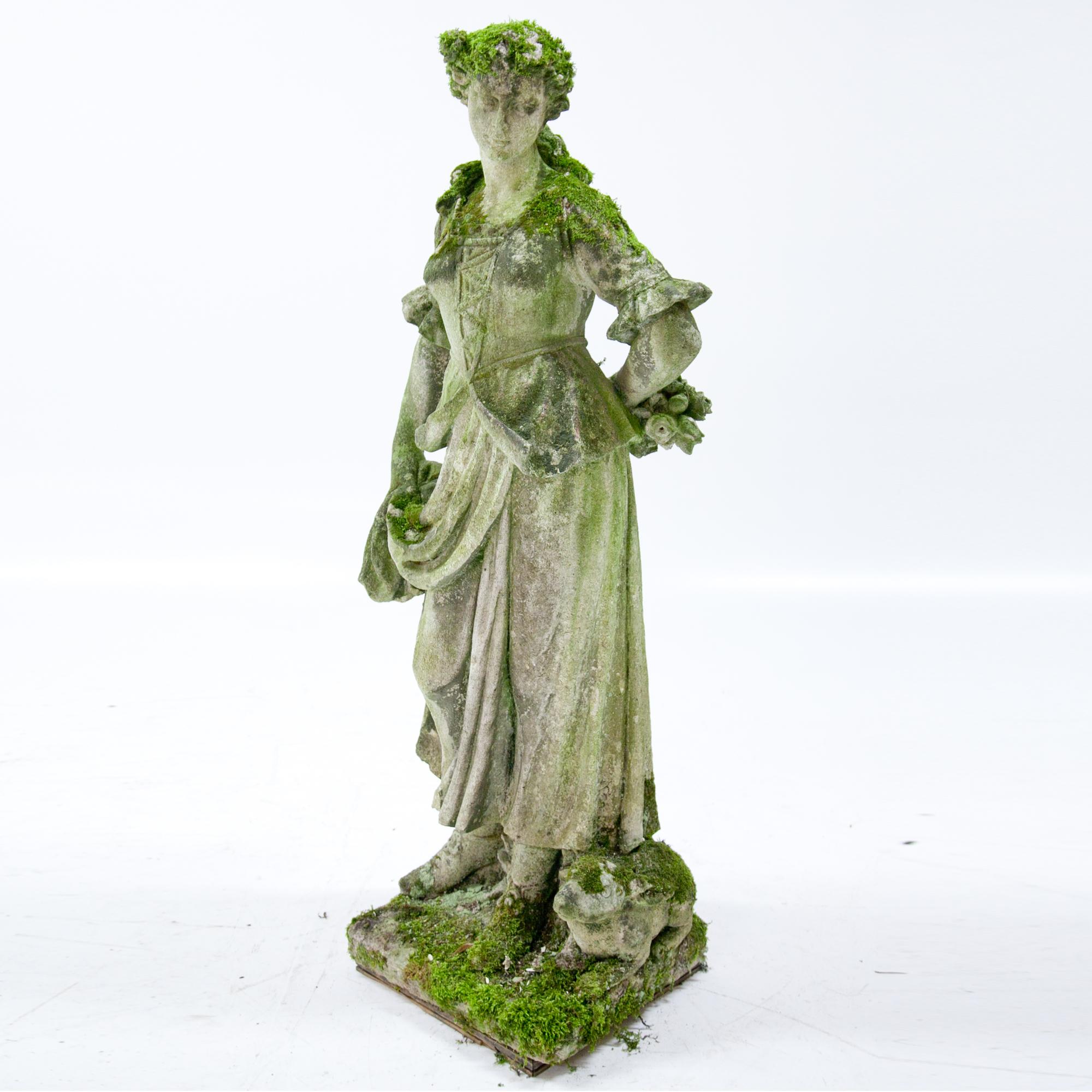 Italian pastoral sculpture of a flower girl with a bouquet of flowers behind her back and her skirt gathered in one hand. A rabbit sits on her side. Very detailed carving in Vicenza stone, partly damaged and weathered.