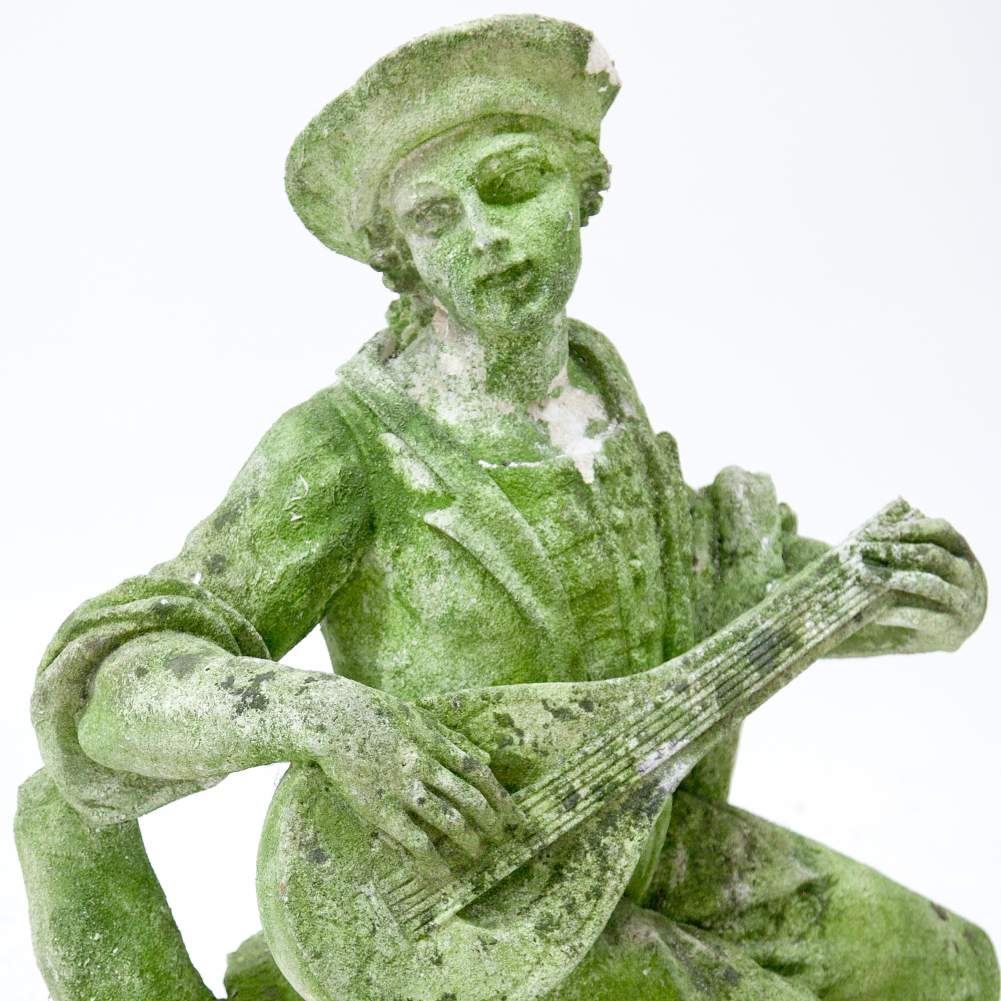 Italian Pastoral sculpture in carved Pietra di Vicenza stone of a seated lute player with a dog at his feet. Very detailed carving, partly damaged and weathered. Provenance: England.