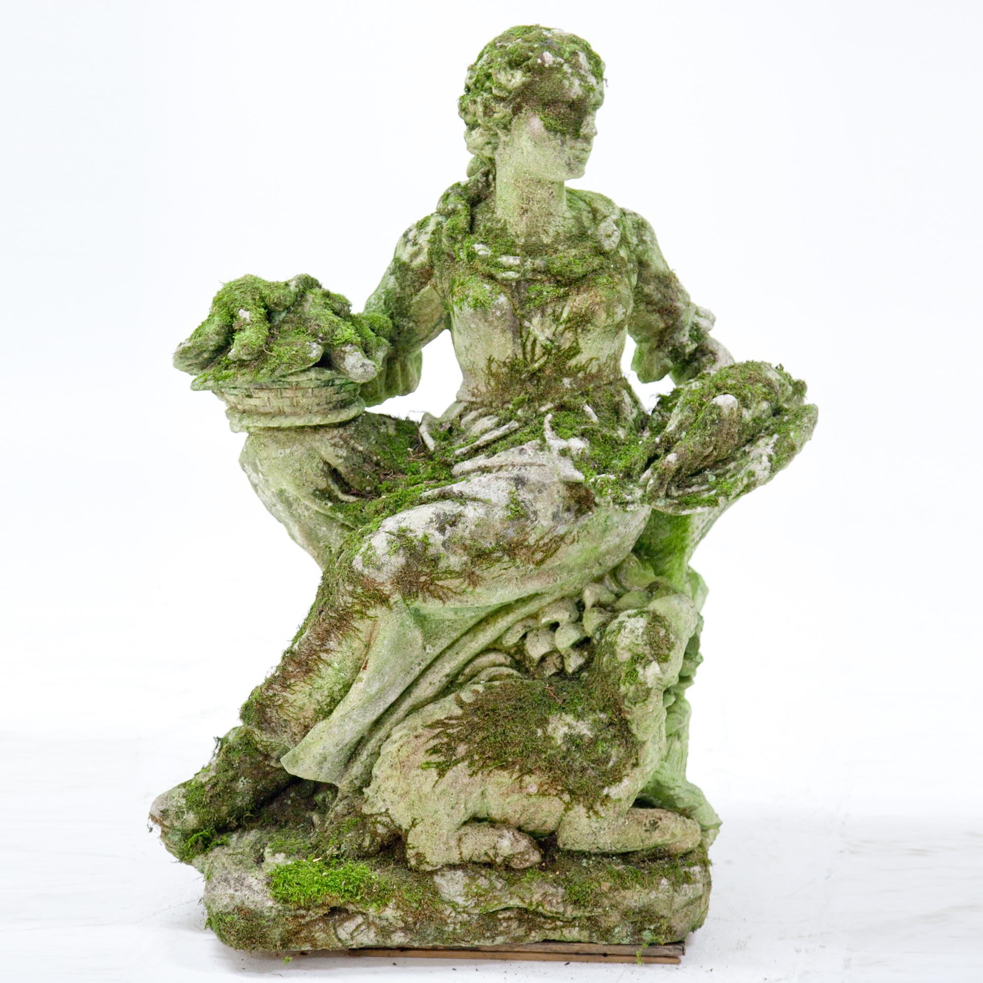 Italian pastoral figure of a poultry seller, seated on a tree trunk, with baskets full of her wares, carved Pietra di Vicenza stone. A lamb nibbles on some grass blades towards her feet. Very detailed carving, partly damaged and weathered.