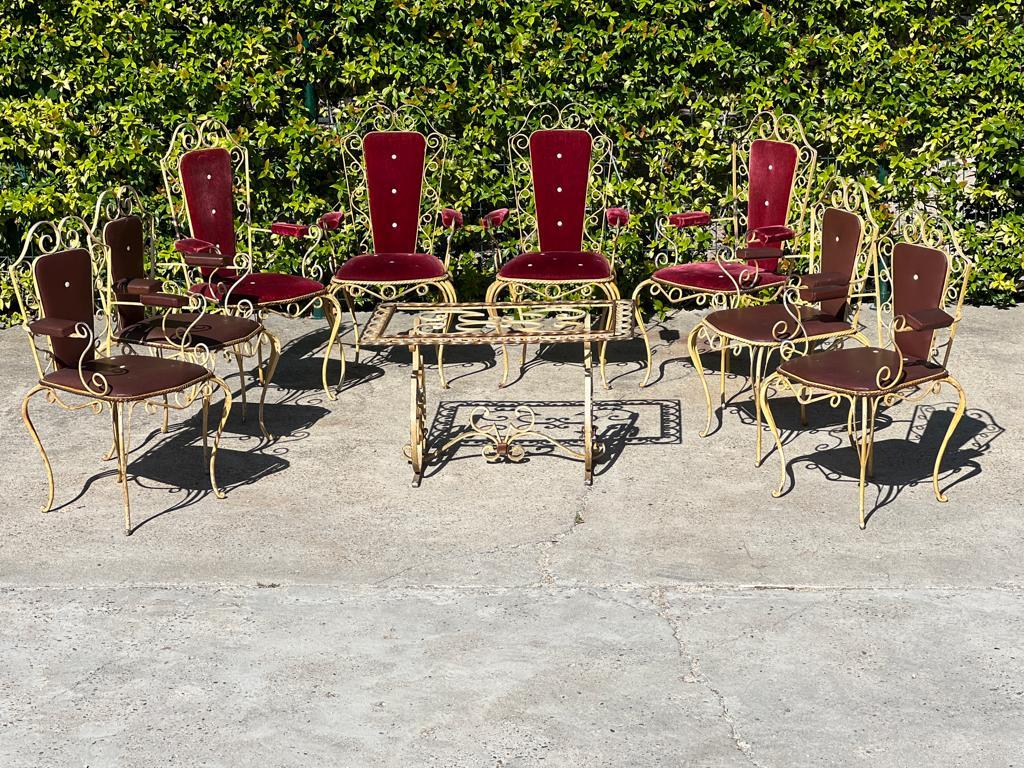 Garden set attributed to René Drouet in wrought iron decorated with curves and volutes. French work 1940 including : 

4 burgundy velvet armchairs: Height: 107 x Width: 55 x Depth: 54 cm 
Seat height: 46 cm 
4 brown ski armchairs: Height 95 x Width