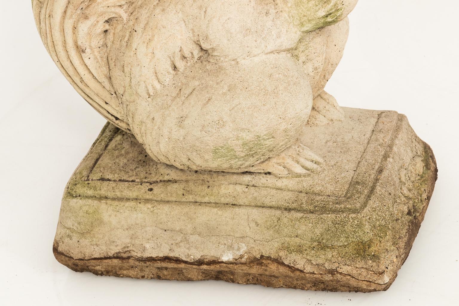 Cement squirrel base bench in a weathered finish, circa late 20th century.
 