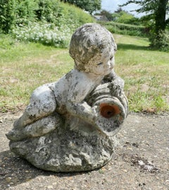 Garden Statue of a Cherub Holding an Urn Water Feature A lovely little piece we