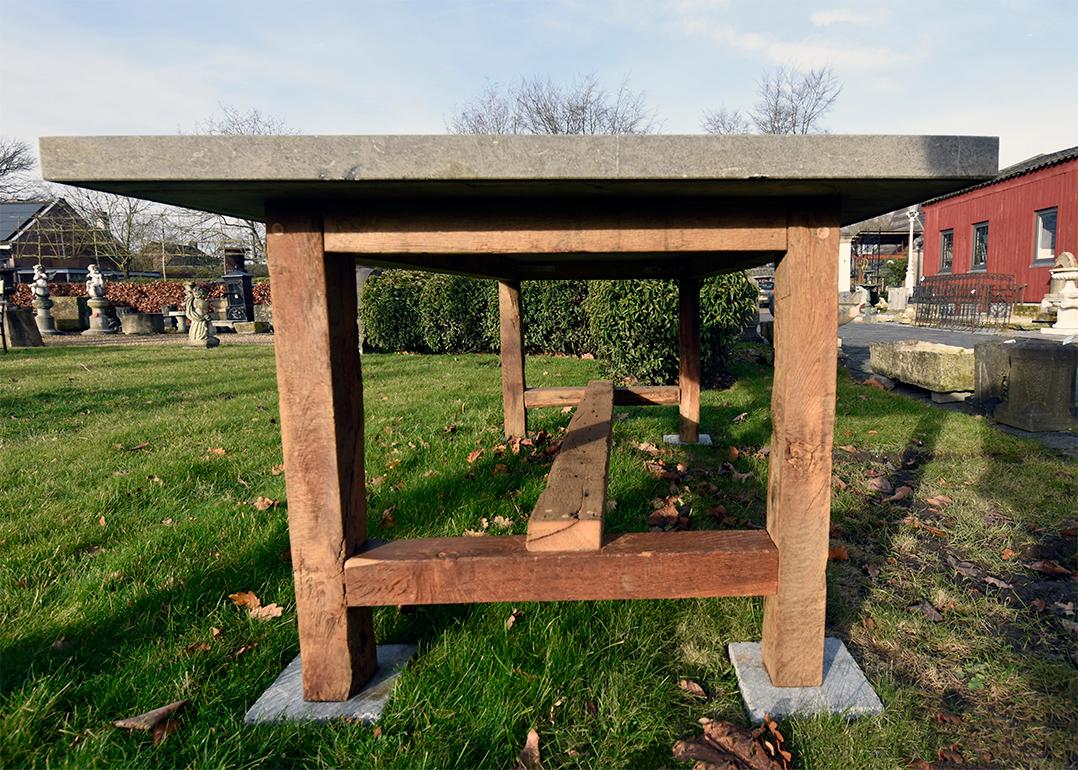 The table consists of old oak feet and a Belgian bluestone top
from 4 cm thickness.