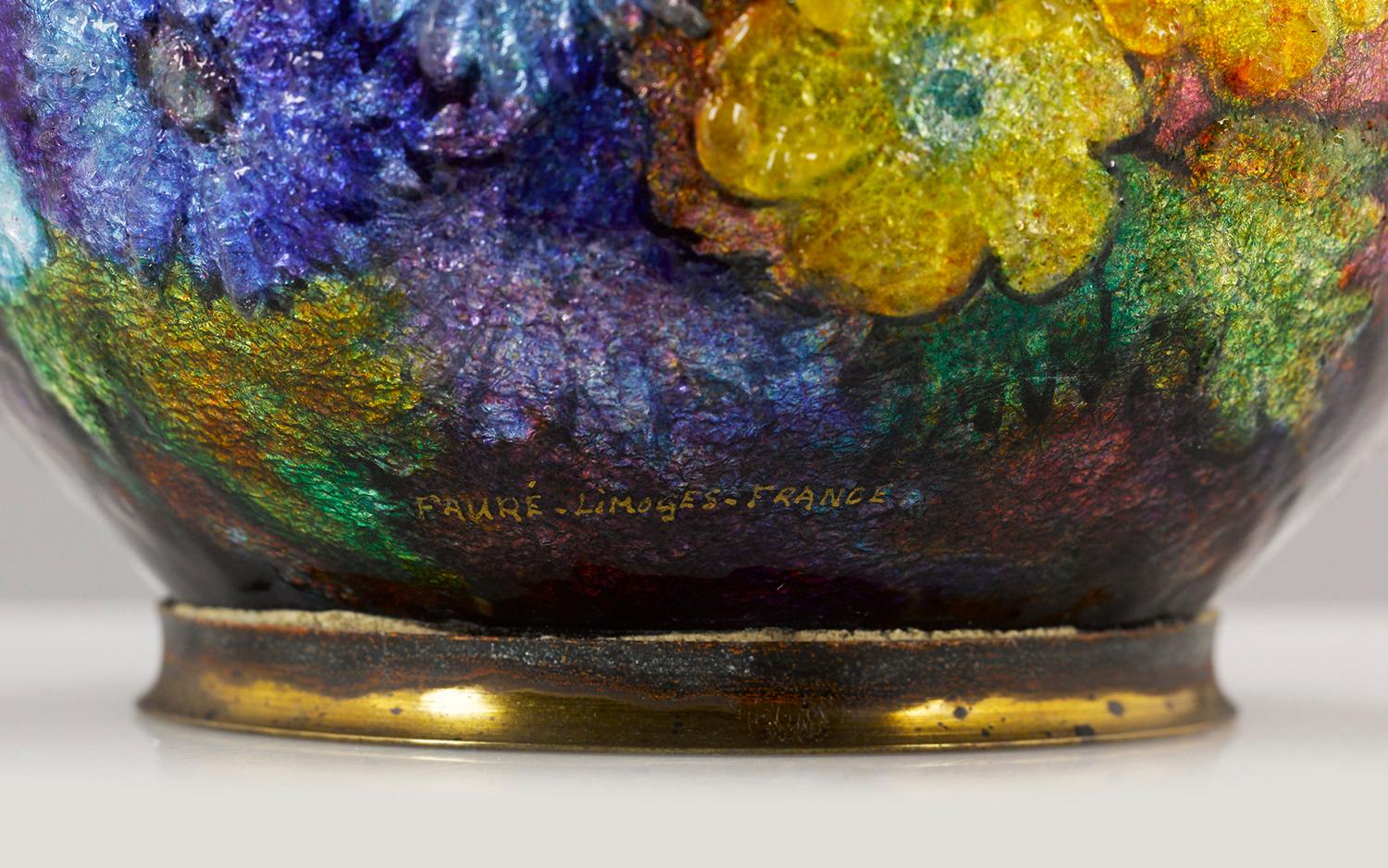 A rainbow of blooms cover this rare Limoges enameled vase by Camille Fauré. The firm employs its signature raised enameling in this piece, which is achieved by applying silver leaf and an enamel paste to a copper base form and “building it” before