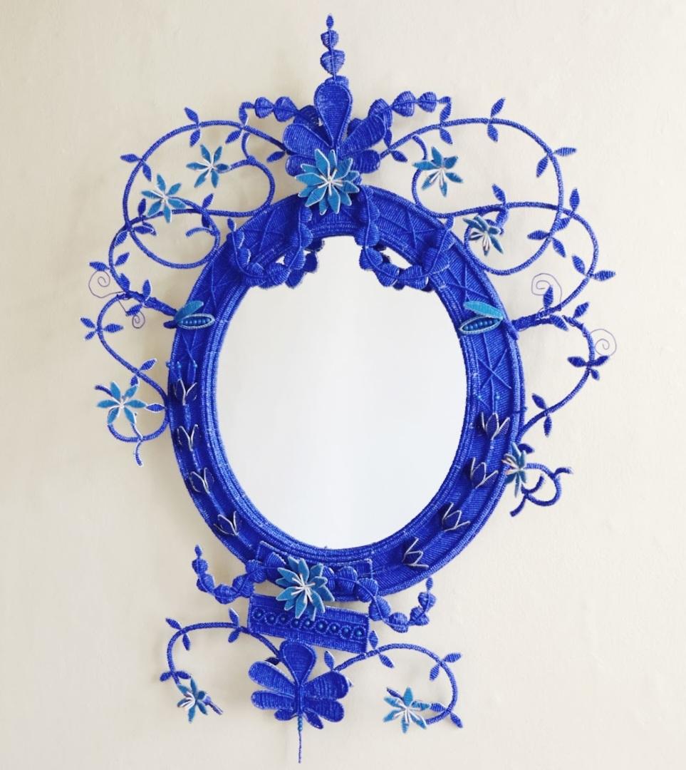 his Gardener's mirror is truly a product from the global village: made from materials from China and Czech, inspired by a Scottish architect working in England 250 years ago, and finally created by a Zimbabwean and South African duo - so much to be