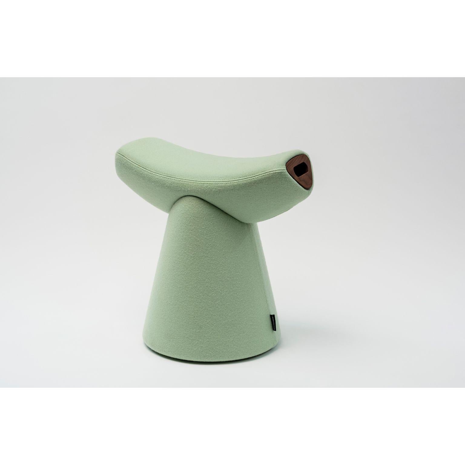 Gardian stool with handle by Patrick Norguet.
Materials: Fabric (also available in leather)
Handle: Noce Canaletto solid wood
Dimensions: W 51.1 x D 34.7 x H 49.8 cm

For the Gardian stool by designer Patrick Norguet, the concept of seating was