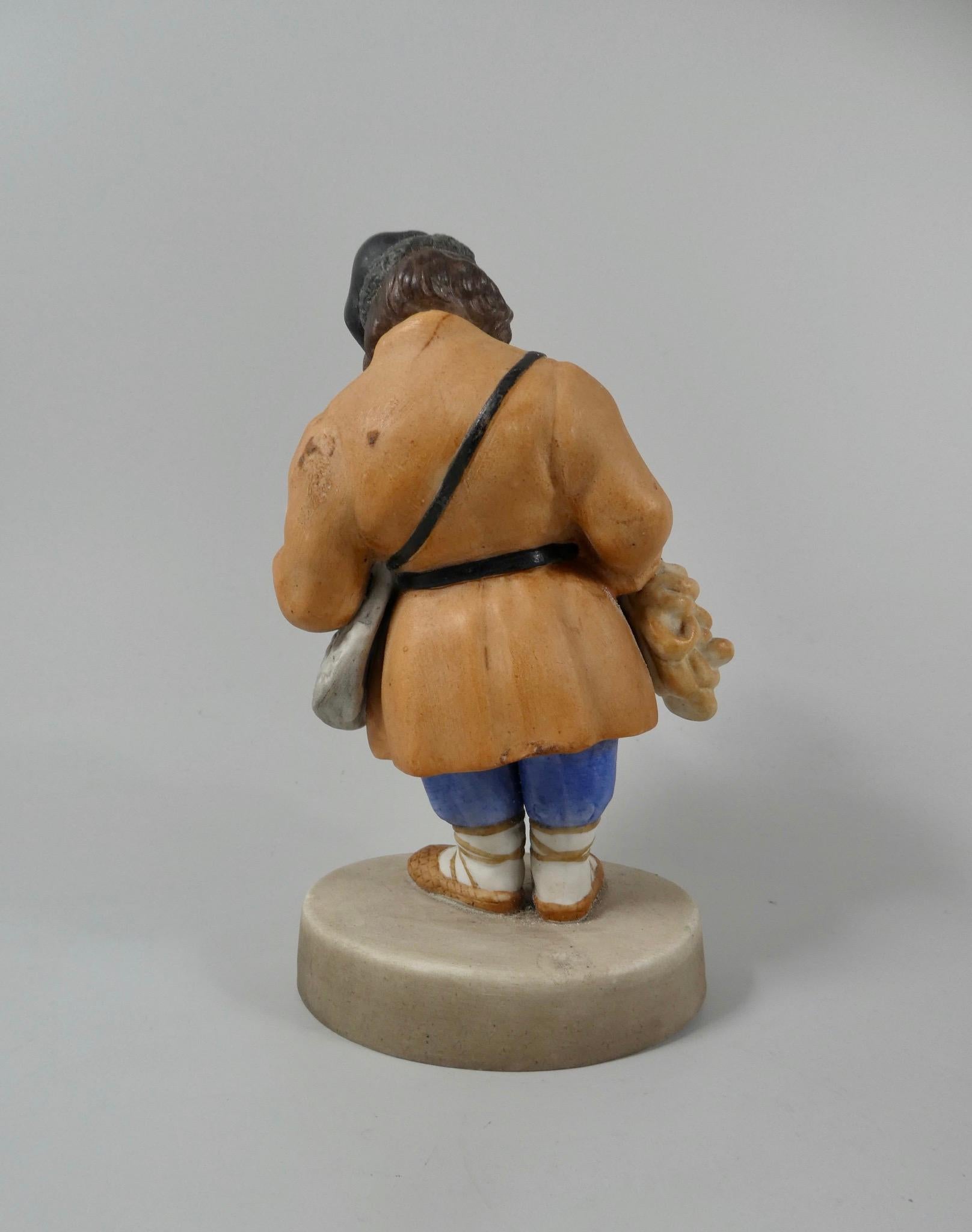 Fired Gardner of Moscow biscuit porcelain figure ‘Sbiten Vendor’, c. 1870.