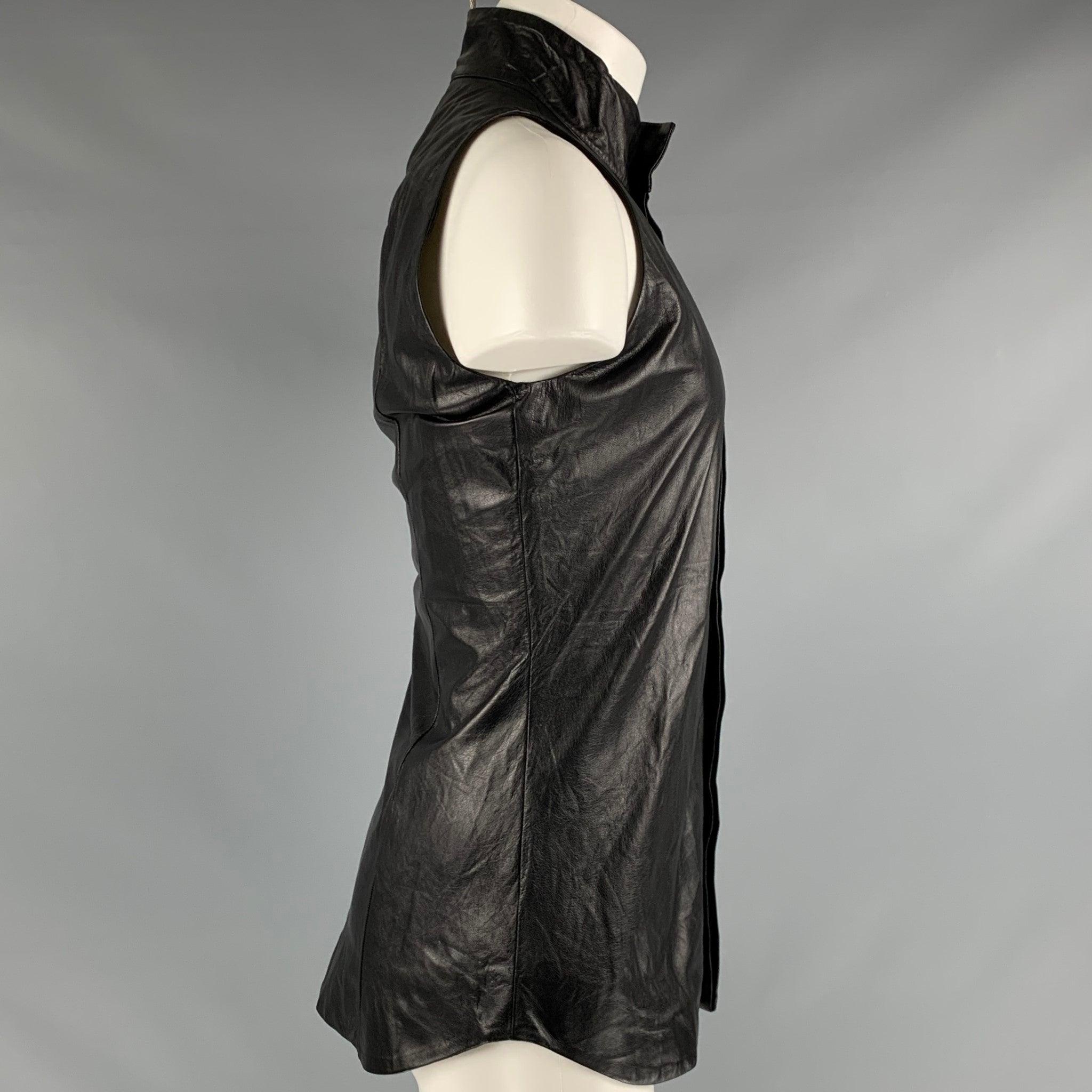 GARETH PUGH short sleeve shirt
in a black leather fabric featuring sleeveless style, and hidden button closure. Made in Italy.Very Good Pre-Owned Condition. Minor marks. 

Marked:   IT 46 

Measurements: 
 
Shoulder: 11.5 inches Chest: 36 inches