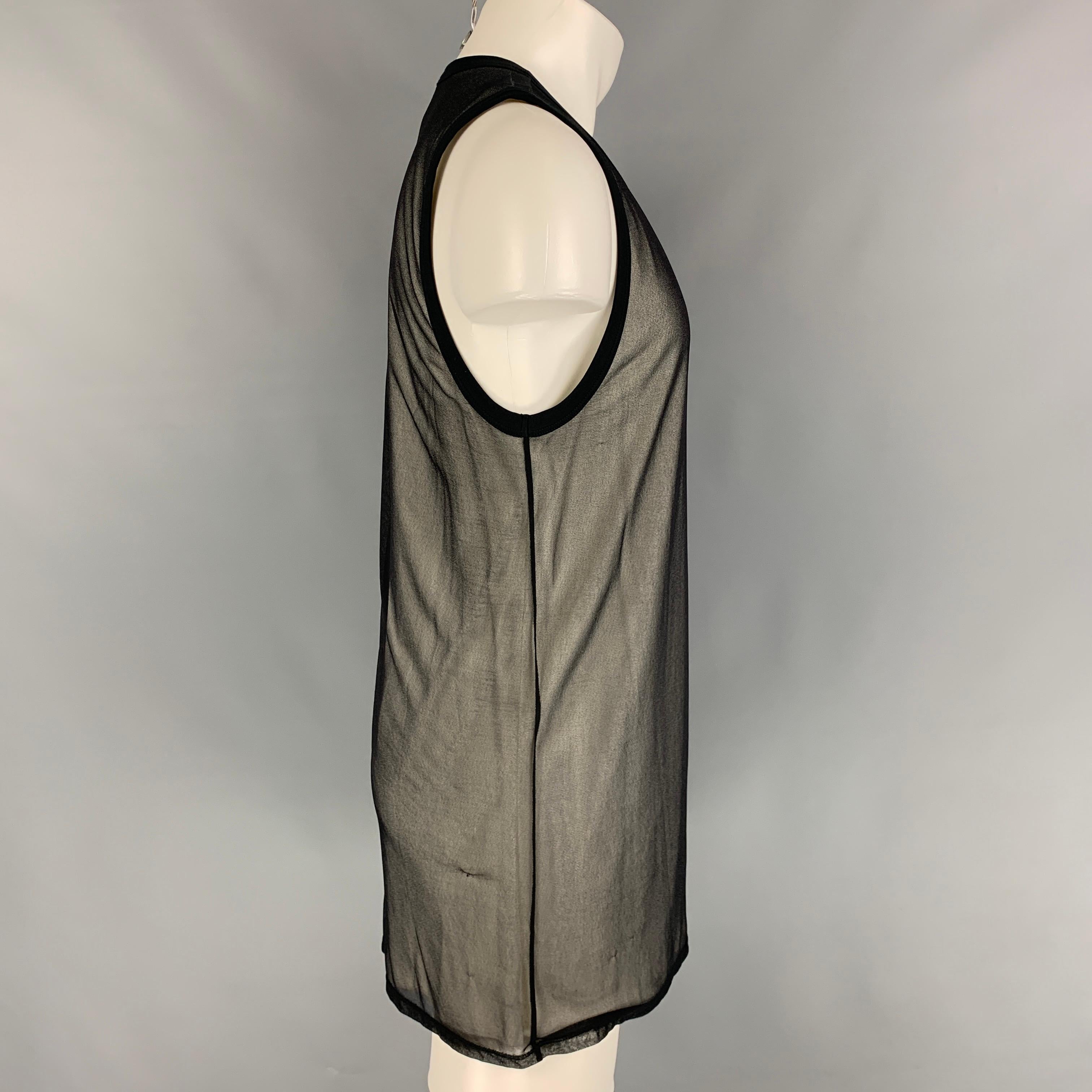 GARETH PUGH tank top comes in a black & white sheer cotton featuring a overlay style and a crew-neck. Made in Italy. 

Very Good Pre-Owned Condition.
Marked: 50

Measurements:

Shoulder: 15 in.
Chest: 38 in.
Length: 34 in. 