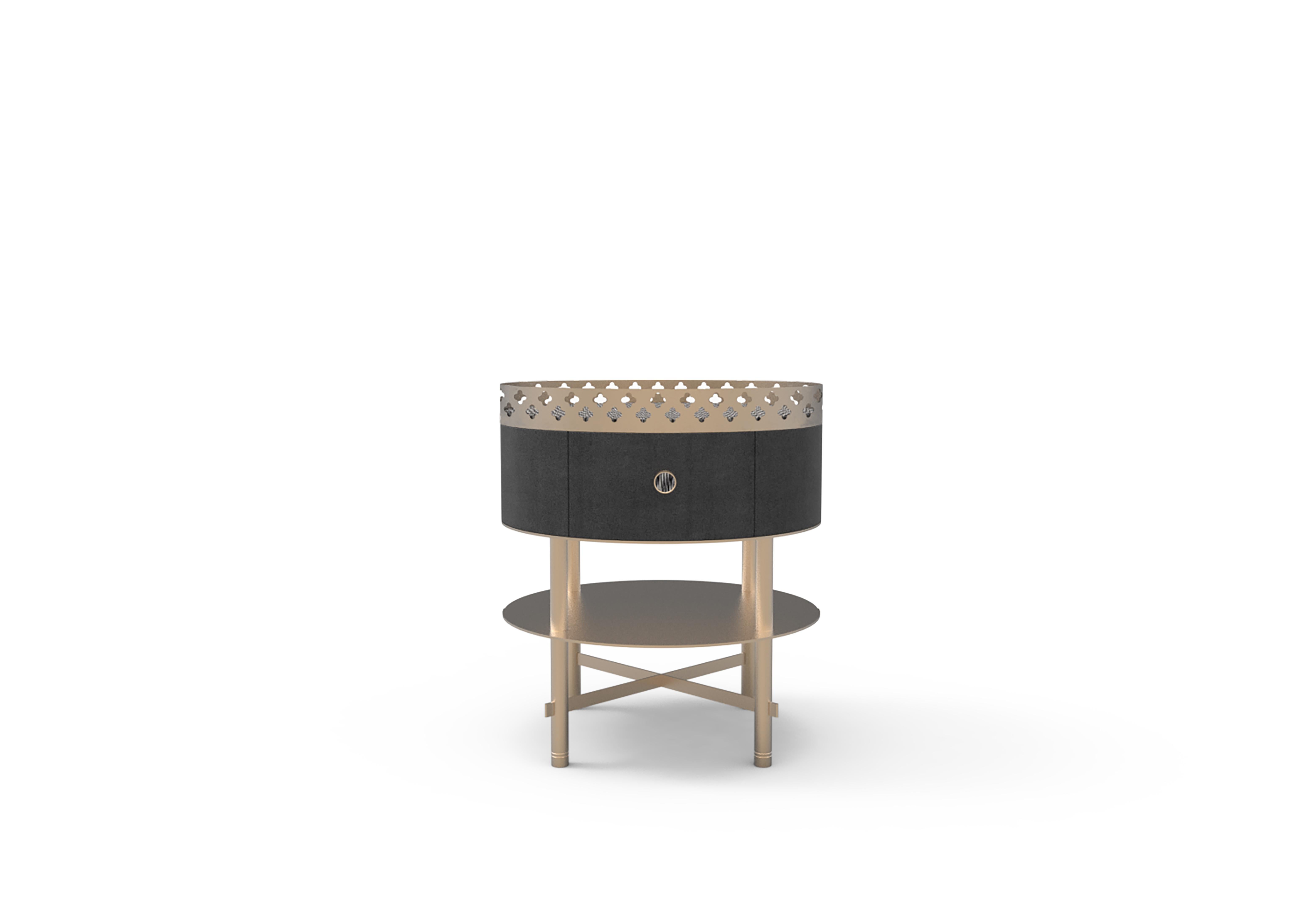 Round side table composed by a wooden compartment with drawer, top shelf in metal, lower shelf in metal. Laser-cut interlocking tubular structure in metal and laser-cut metal sheet with flower motifs finished manually.