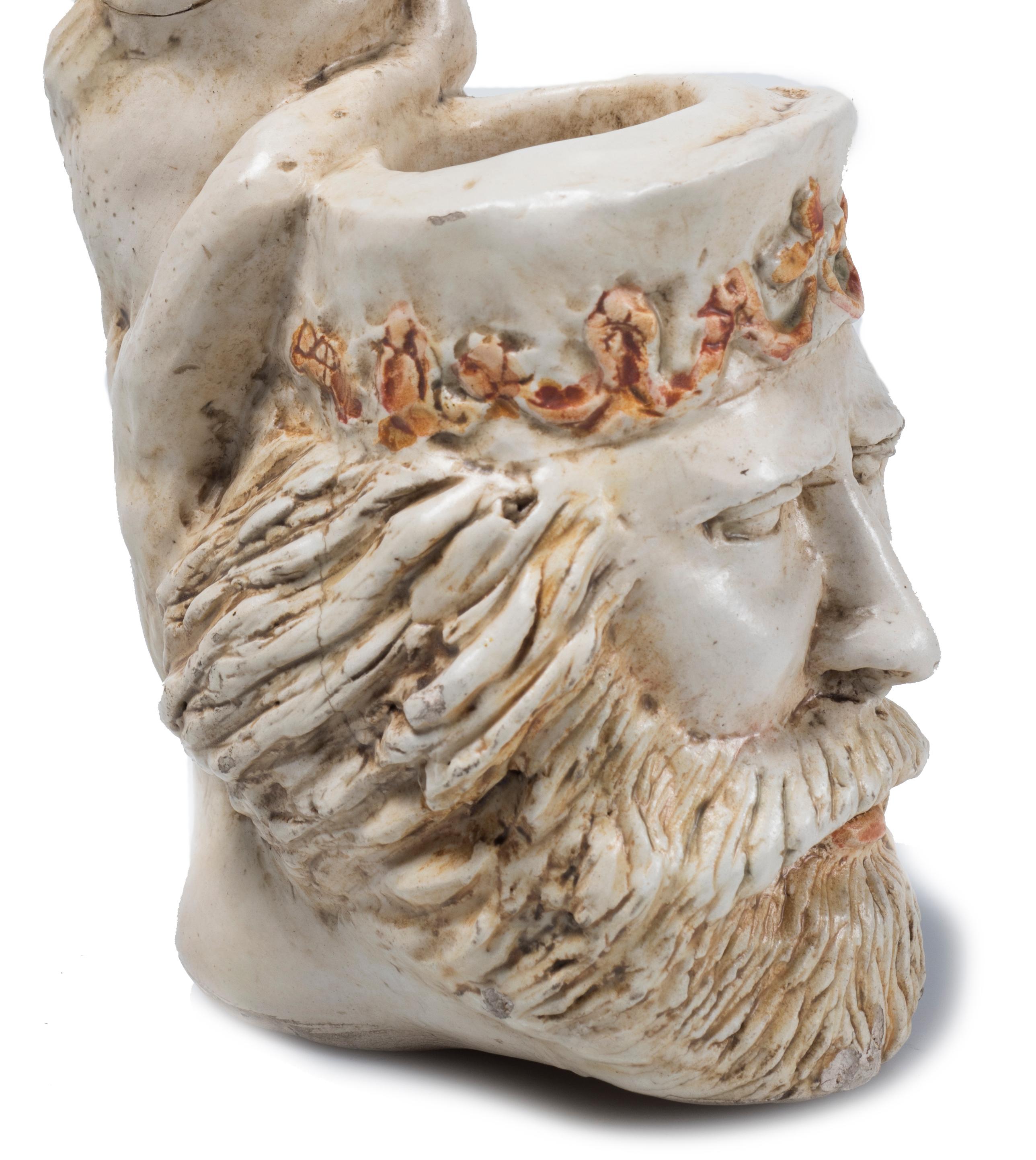 Garibaldi's Pipe is an original decorative object in earthenware with the cooker as Garibaldi head and cane shaped as a bust of a woman. Signed “Agostinelli” on base.

Repaired crack on cane, otherwise good conditions.

This artwork is shipped