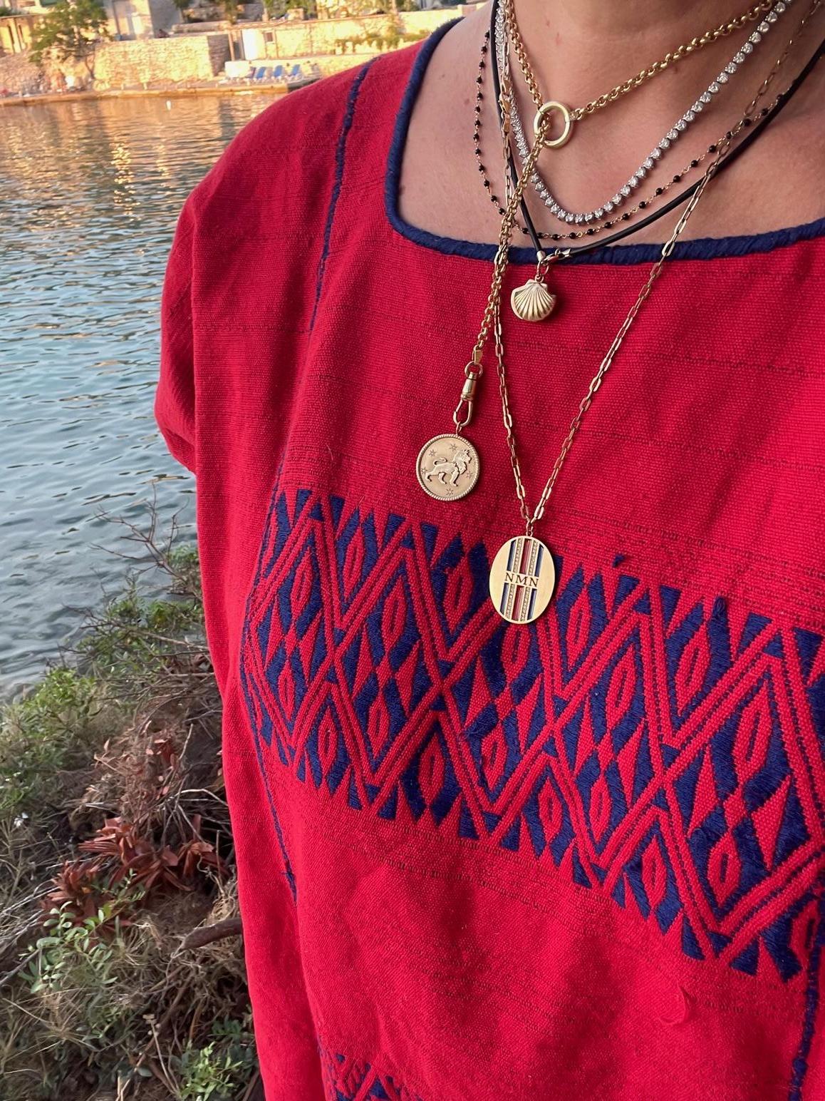 Garland Collection's vintage inspired zodiac medallions are custom and handmade to order in New York City by our team of master jewelers. A polished rope border on each medallion surrounds a matte gold background, while handset diamonds in a