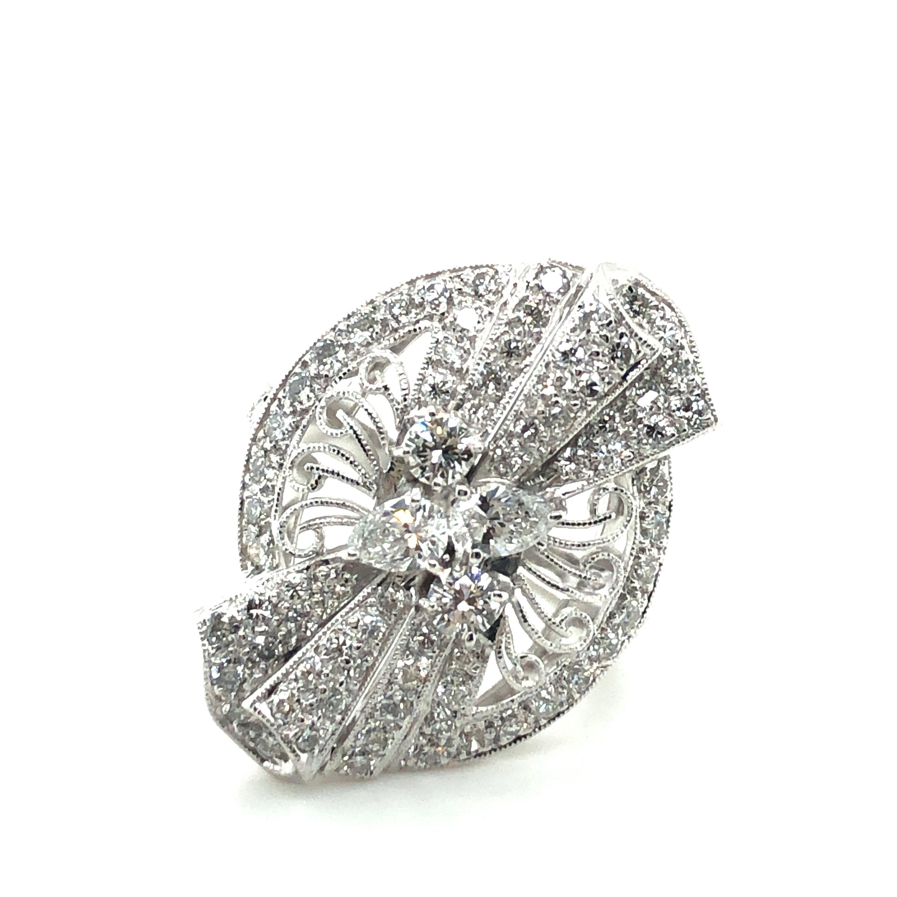 This playful and sparkling garland-style ring in 18 karat white gold is set in the centre with 2 pear-shaped diamonds of F/G colour and vs clarity, total weight approximately 0.20 carats.
In addition the bow motiv and entourage are set with 78