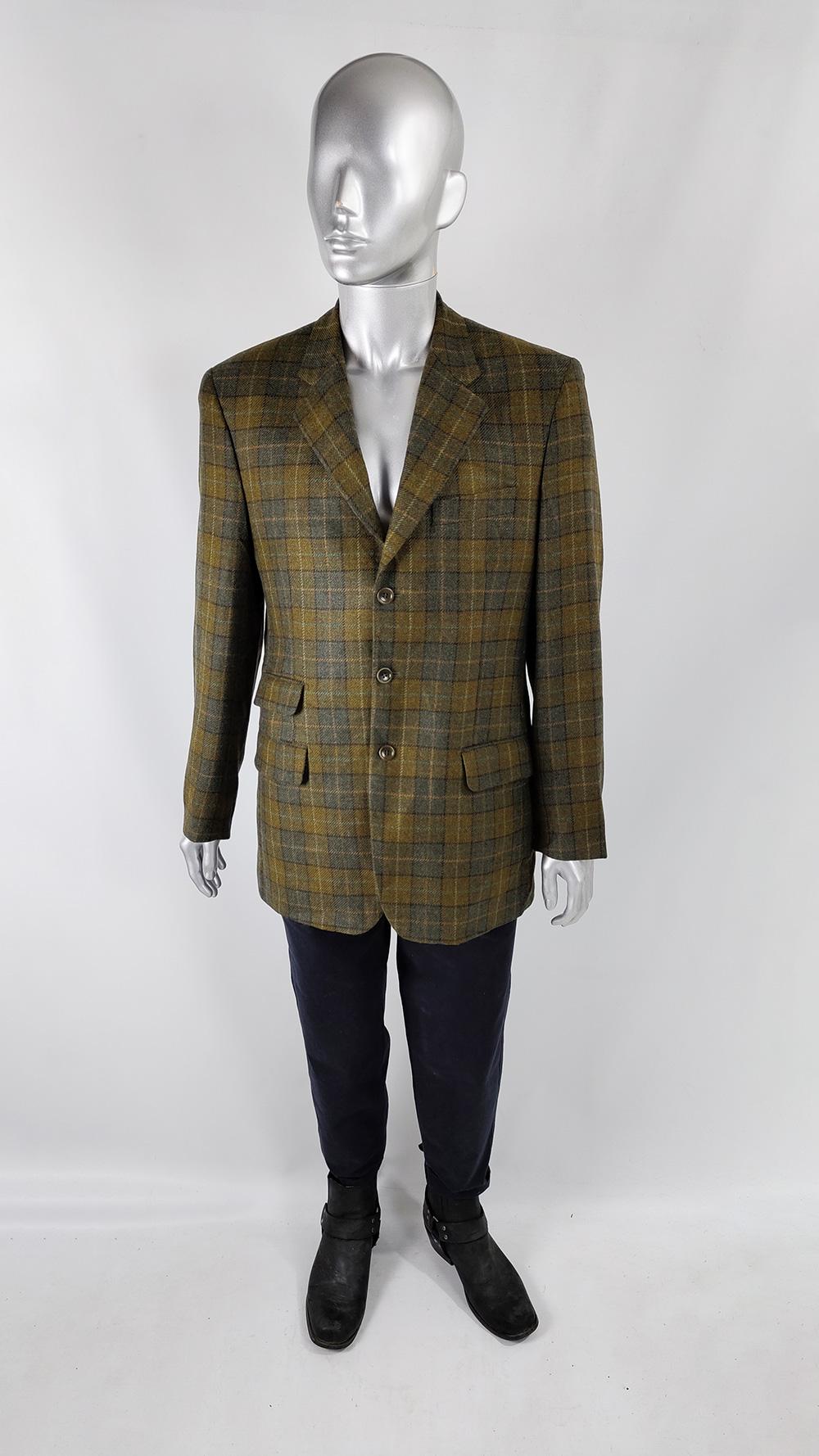 A stylish vintage mens blazer jacket from the 70s by quality Italian label, Garlanda. Made in Italy, from an olive and grey bold checked pure new wool fabric. It has a classic cut with notched lapels, three single breasted buttons to the front and a